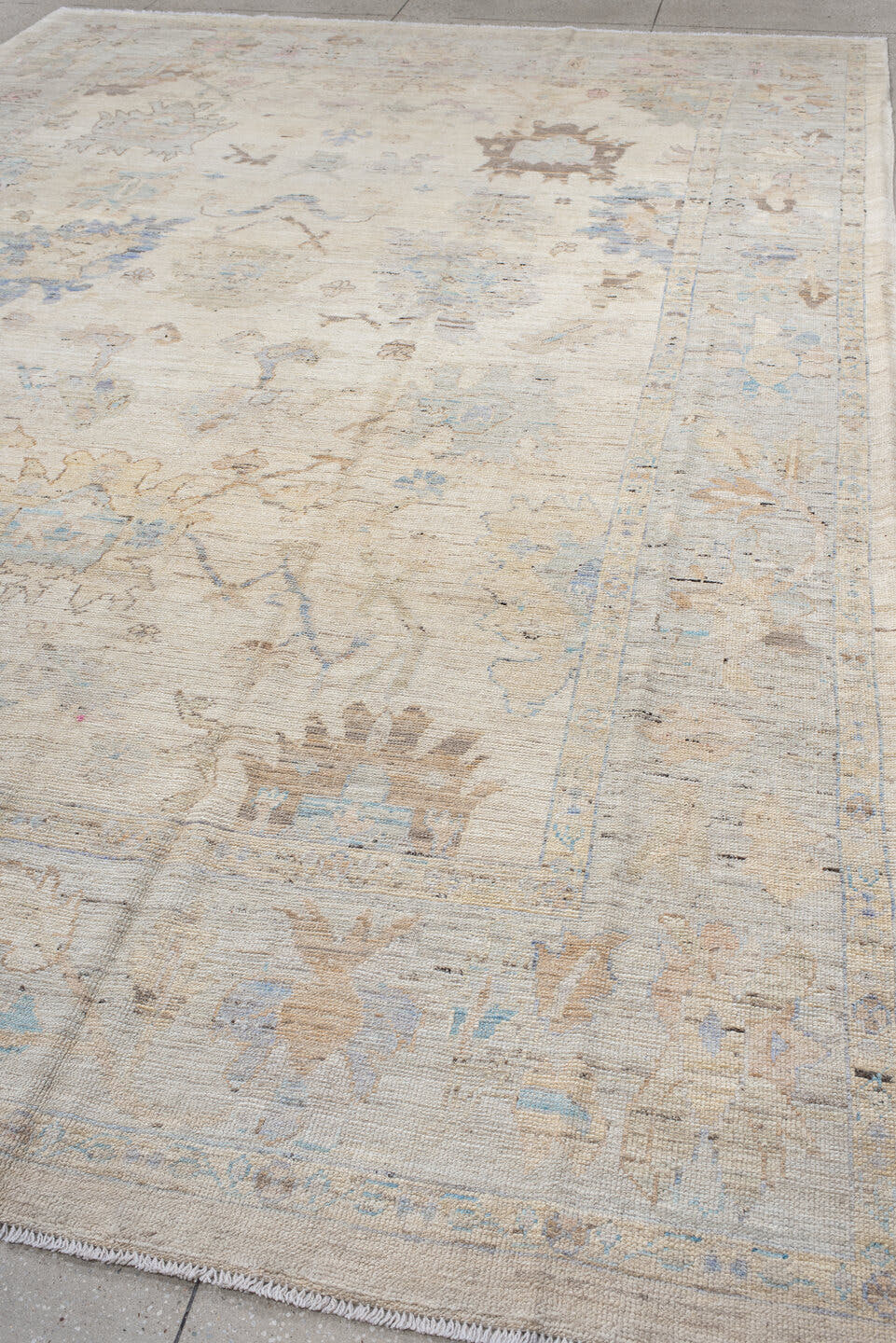 9' x 14' one-of-a-kind handmade vintage Oushak large size rug. Color palette: ivory, pale blue, taupe, beige, blush, camel