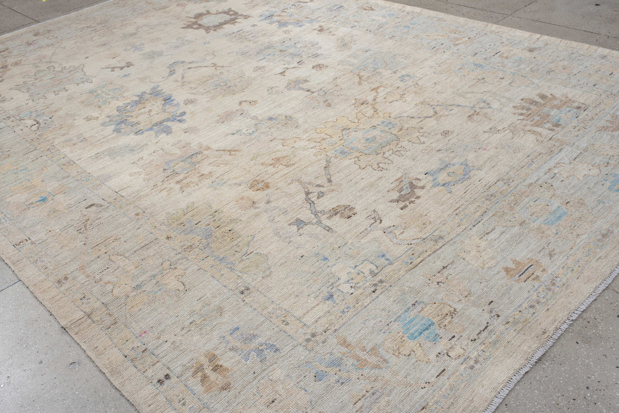 9' x 14' one-of-a-kind handmade vintage Oushak large size rug. Color palette: ivory, pale blue, taupe, beige, blush, camel