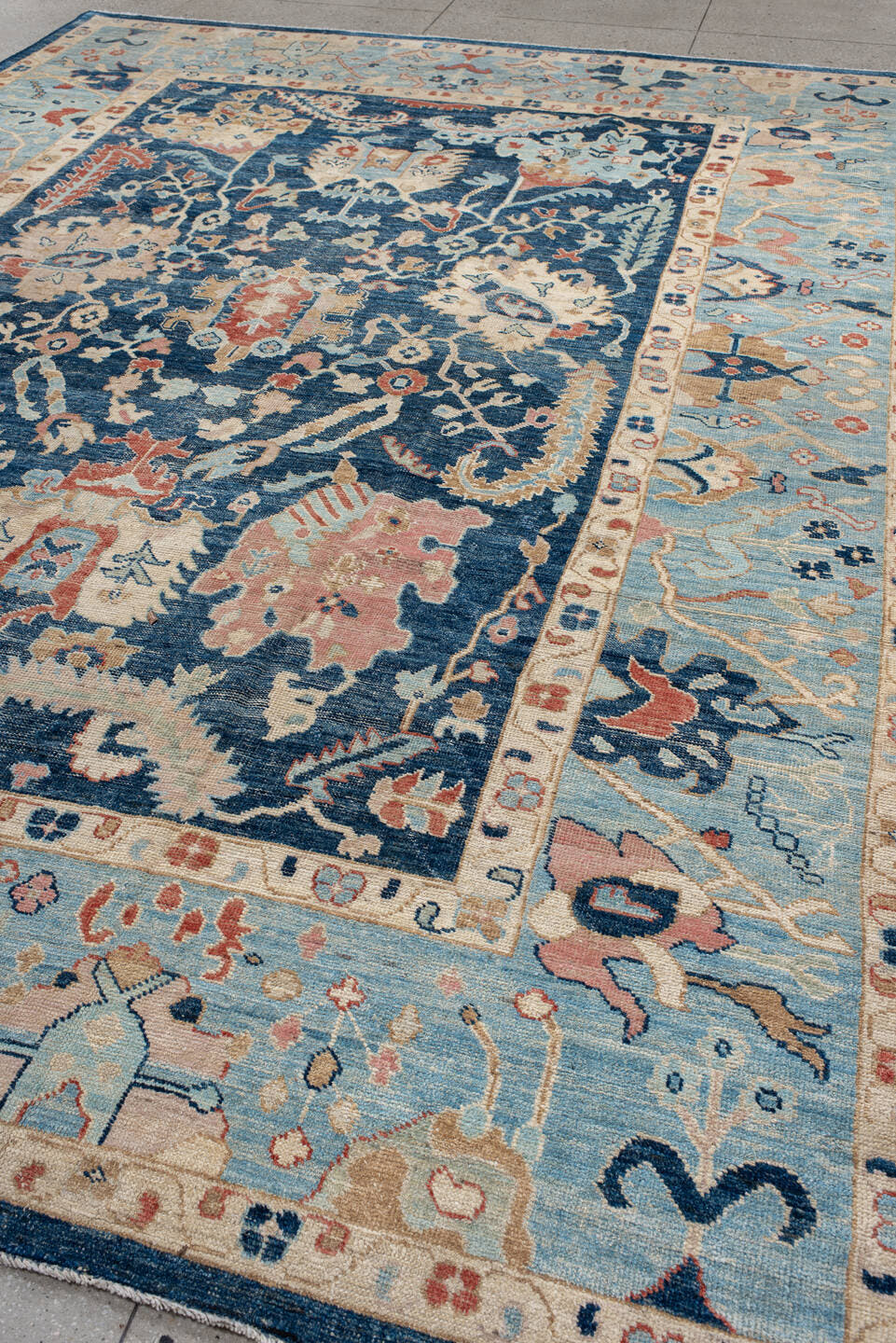 9' x 13' one-of-a-kind handmade vintage Oushak large size rug. Color palette: sky blue, navy, ivory, rust, cream, slate