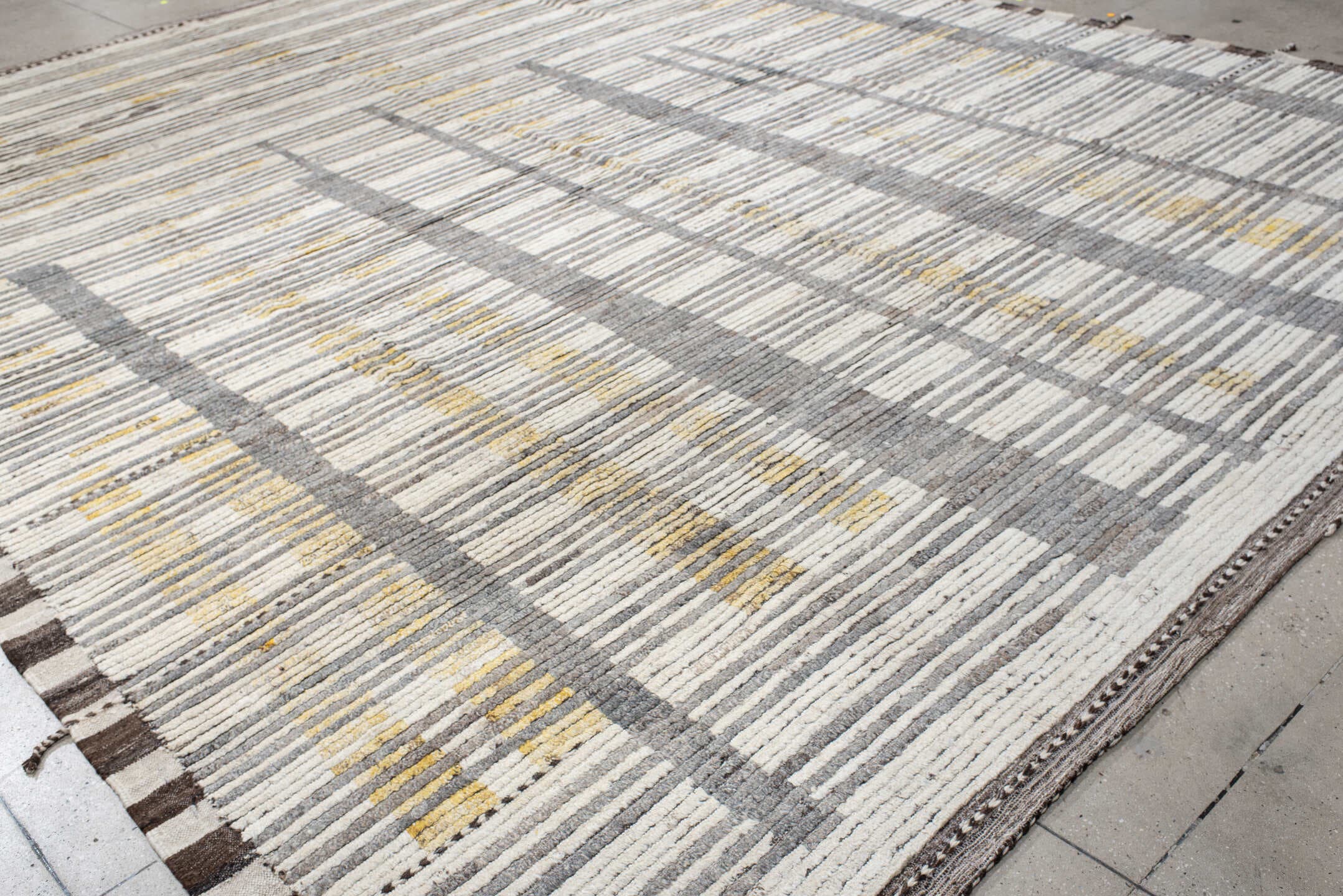 12' x 15' one-of-a-kind handmade vintage Tulu oversize rug. Color palette: ivory, gray, charcoal, gold, taupe, black, beige