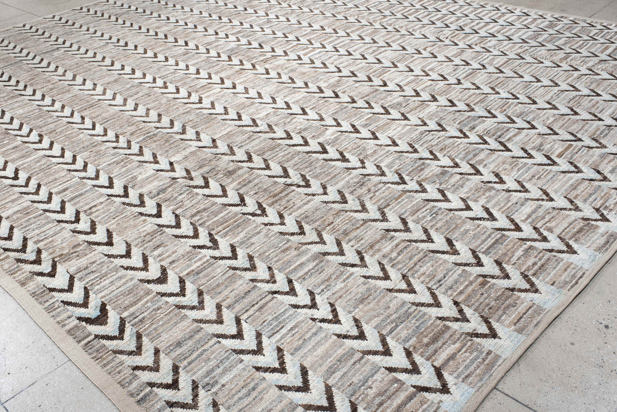 12' x 15' one-of-a-kind handmade vintage Tulu oversize rug. Color palette: ivory, taupe, brown, gray, charcoal, beige, black