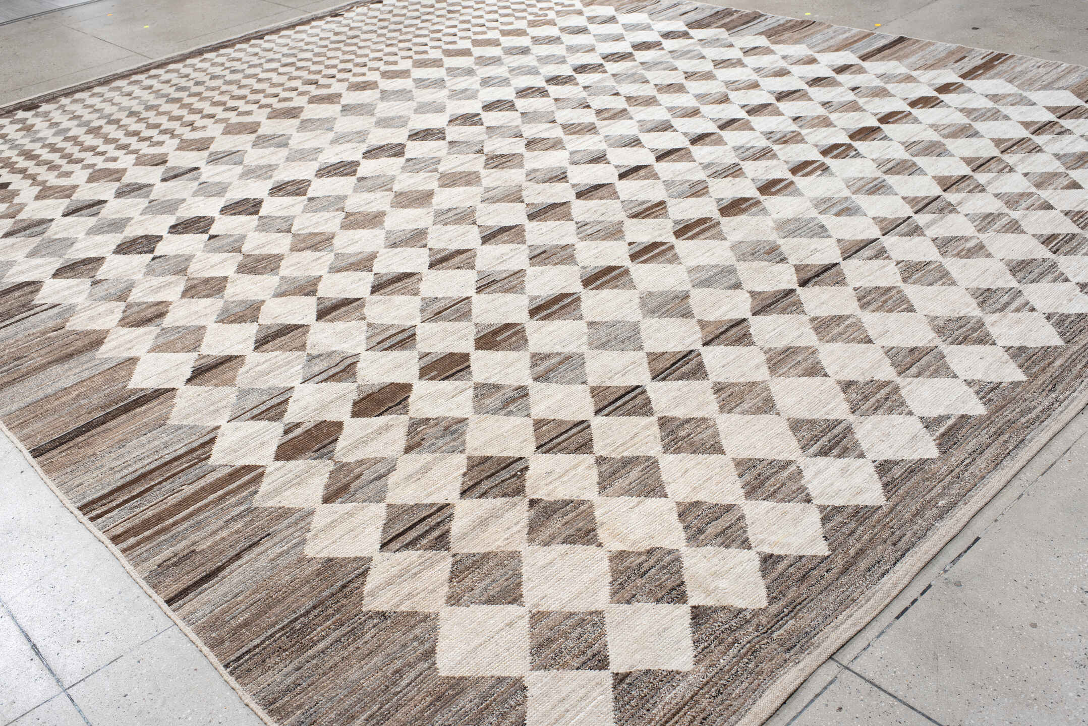 12' x 15' one-of-a-kind handmade vintage Tulu oversize rug. Color palette: ivory, taupe, brown, gray, charcoal, beige, black