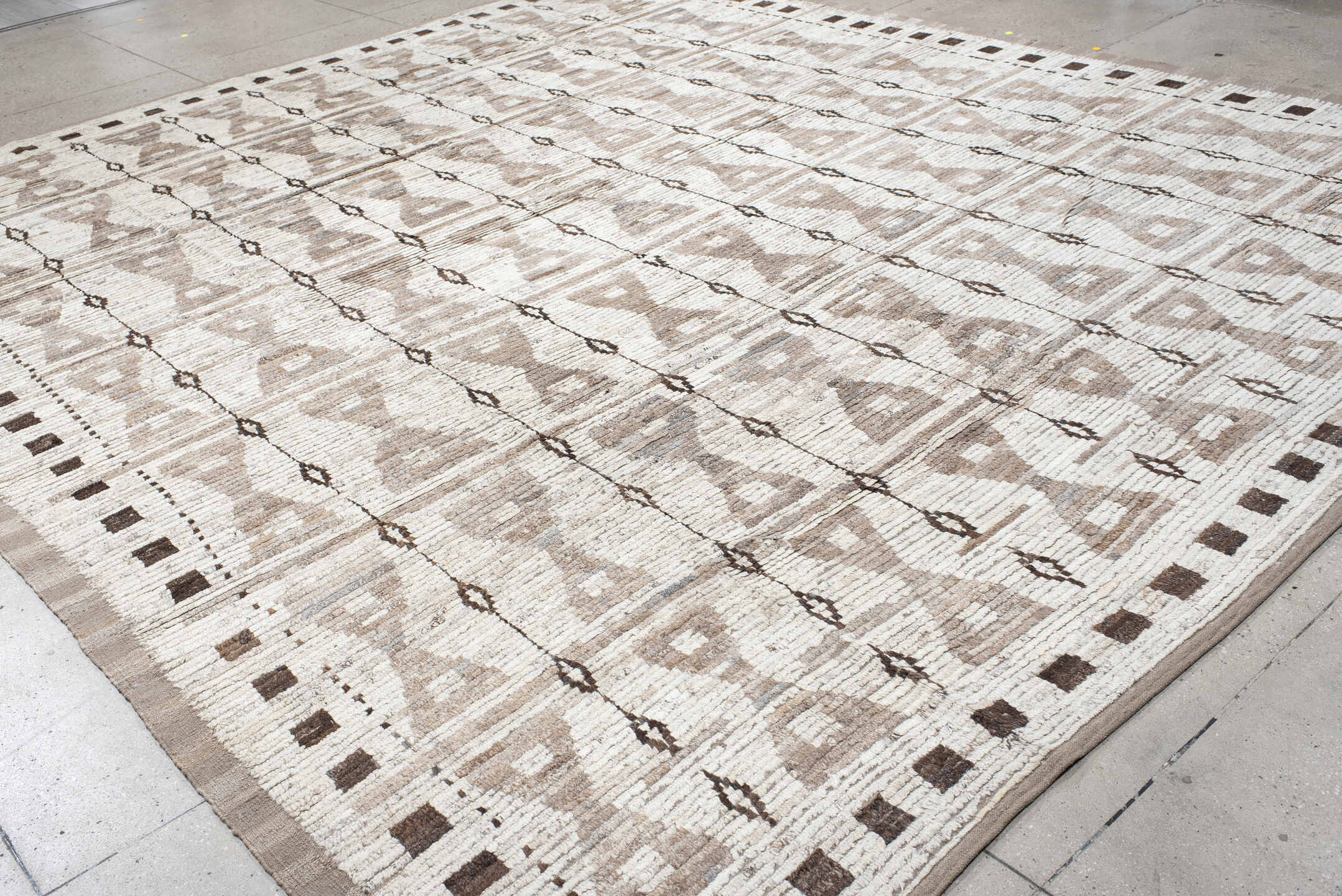 12' x 14' one-of-a-kind handmade vintage Tulu oversize rug. Color palette: ivory, taupe, brown, charcoal, beige, gray, black