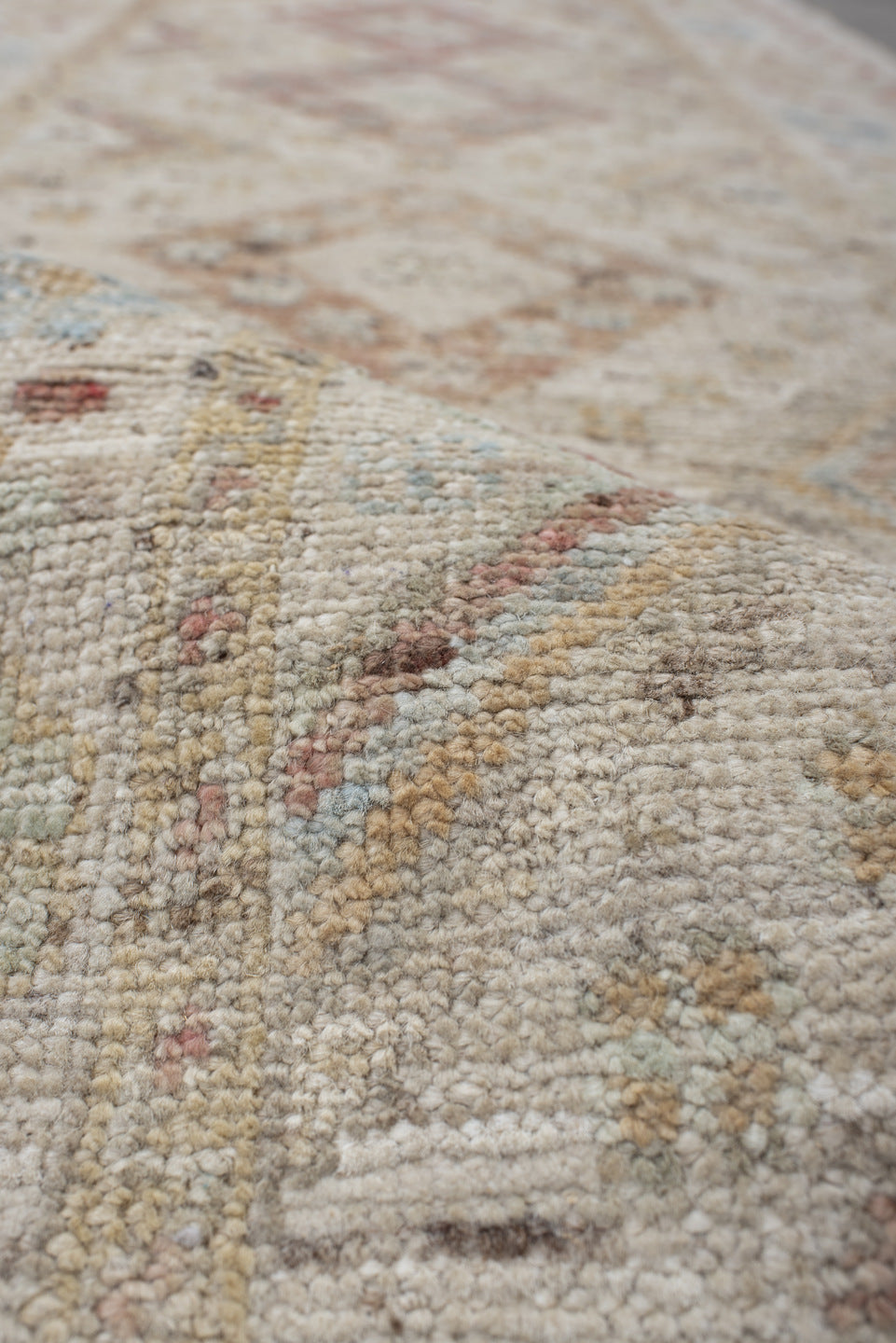 2' x 10' one-of-a-kind handmade vintage Tulu runner rug. Color palette: ivory, blush, pale blue, beige, taupe, sage, camel