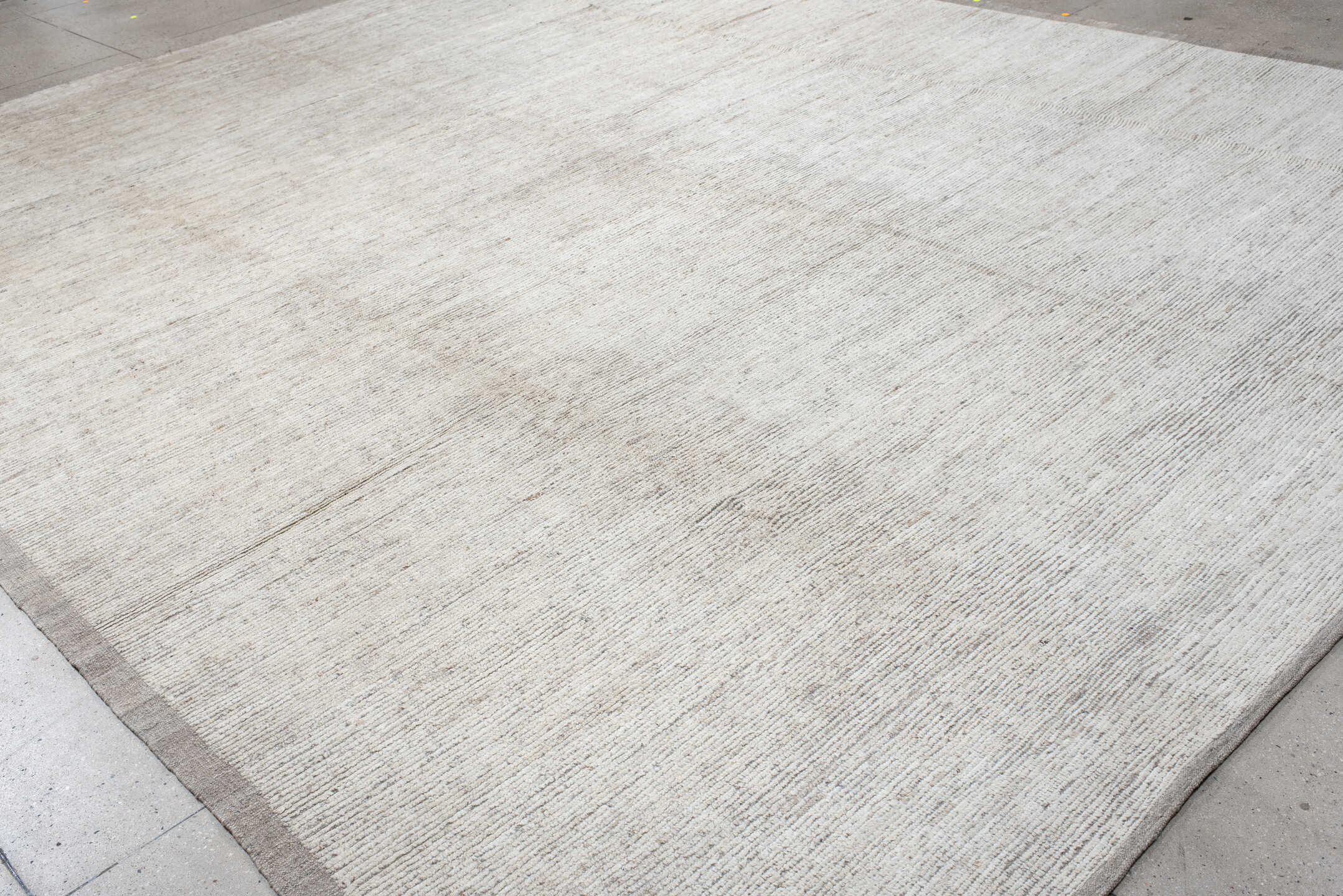 12' x 15' one-of-a-kind handmade vintage Tulu oversize rug. Color palette: ivory, cream, taupe, beige, gray