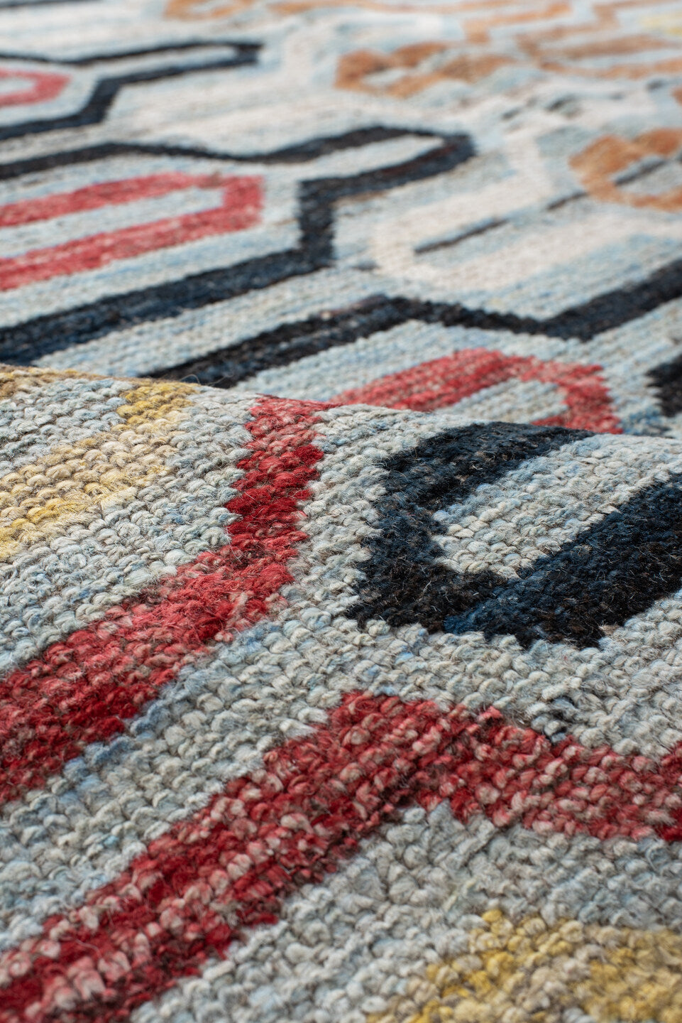 6' x 9' one-of-a-kind handmade vintage Tulu medium size rug. Color palette: red, pink, gray, orange, brown, yellow