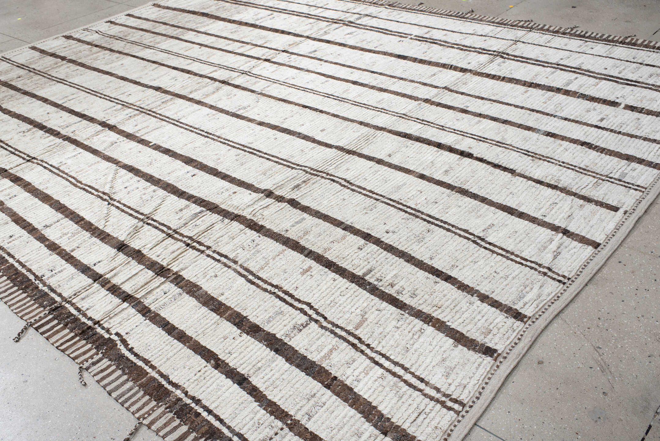 11' x 13' one-of-a-kind handmade vintage Tulu oversize rug. Color palette: ivory, brown, taupe, charcoal, beige, gray, black