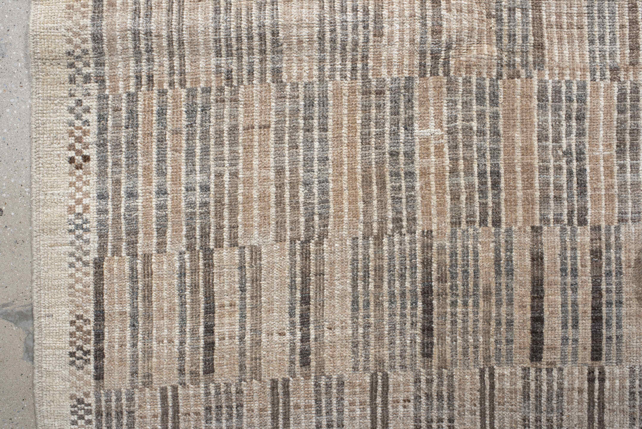 7' x 9' one-of-a-kind handmade vintage Tulu rug. Color palette: ivory, taupe, camel, charcoal, beige, gray, black