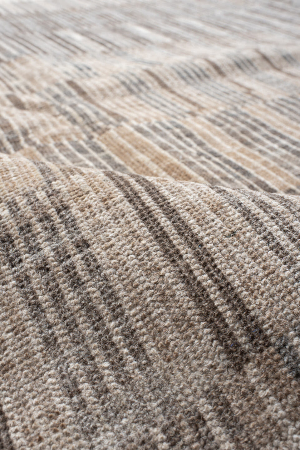 7' x 9' one-of-a-kind handmade vintage Tulu rug. Color palette: ivory, taupe, camel, charcoal, beige, gray, black