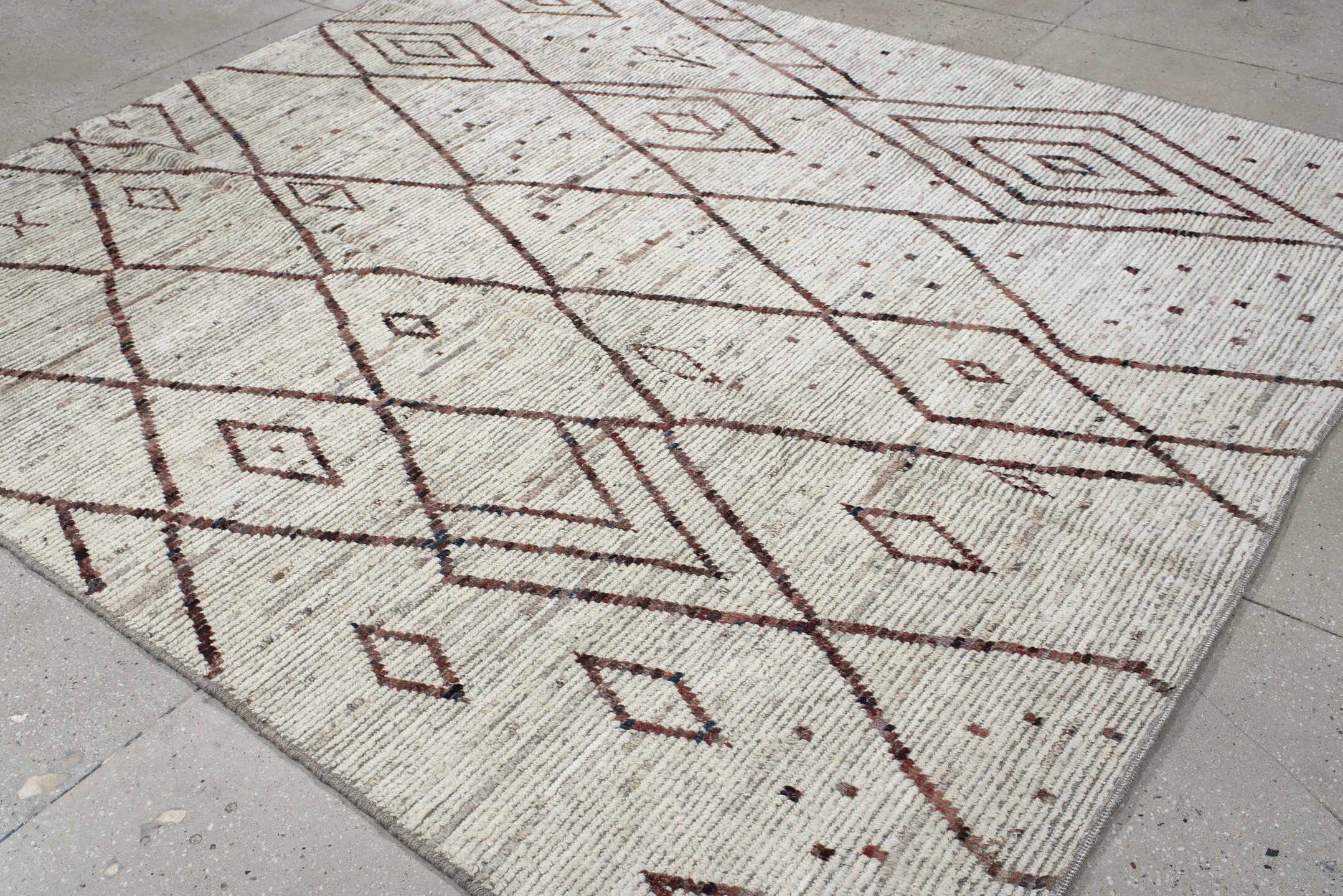 8' x 9' one-of-a-kind handmade vintage Tulu rug. Color palette: ivory, brown, taupe, charcoal, rose, beige, gray, black