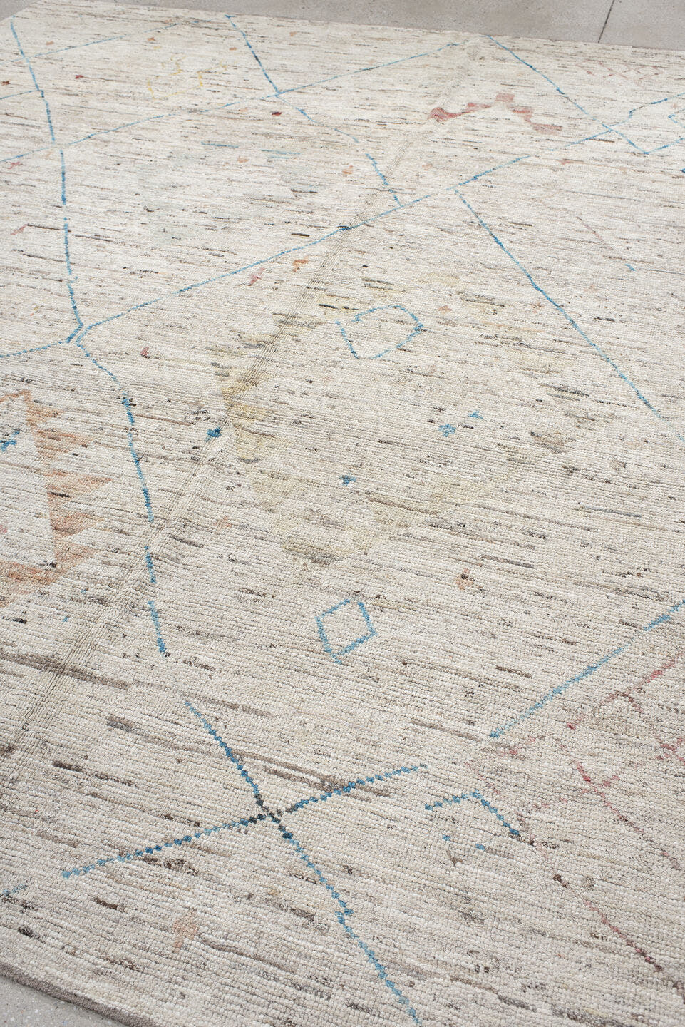 11' x 9' one-of-a-kind handmade vintage Tulu rug. Color palette: ivory, sky_blue, taupe, peach, blush, muted_gold, brown