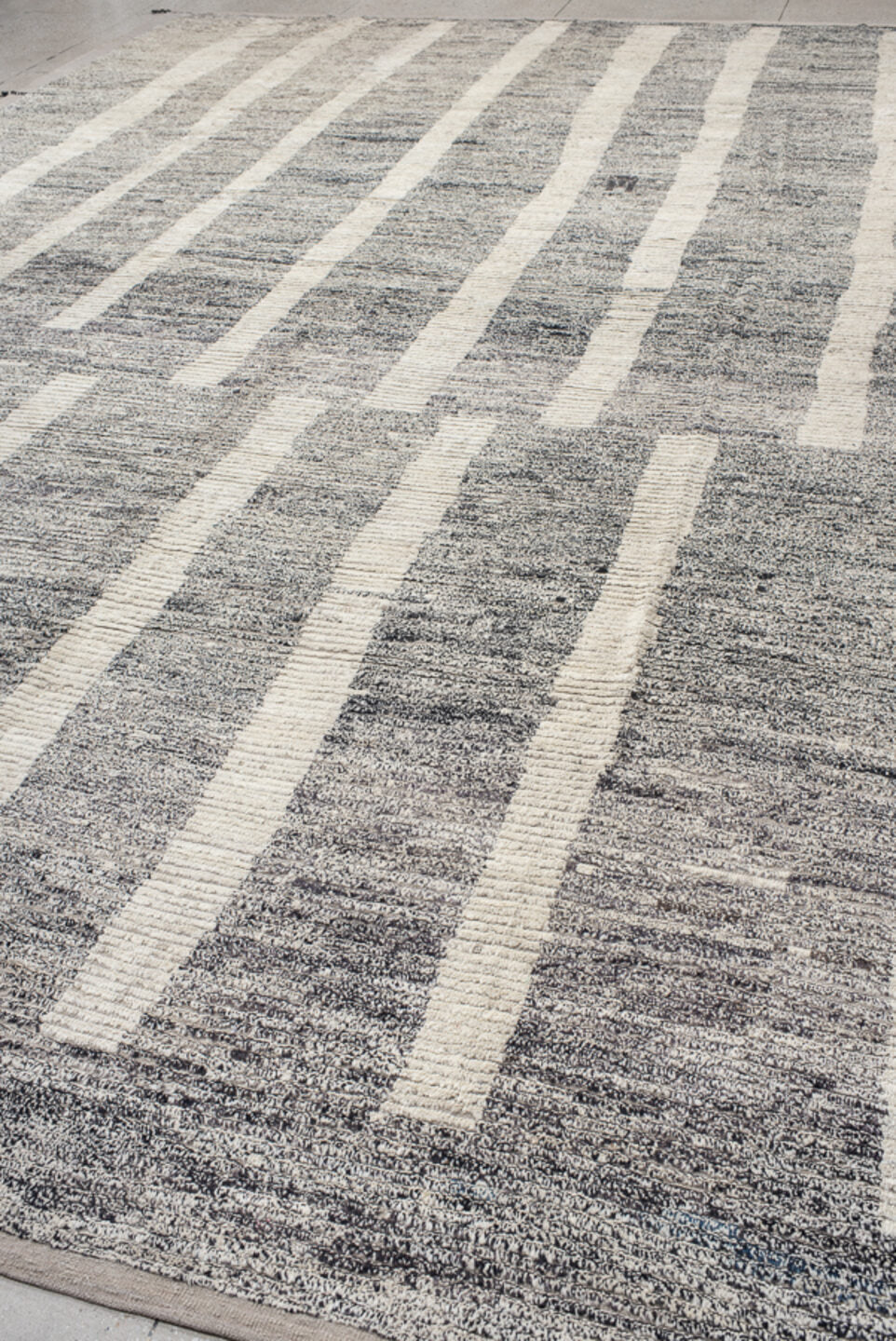12' x 17' one-of-a-kind handmade vintage Tulu oversize rug. Color palette: gray, ivory, charcoal, taupe, black, beige