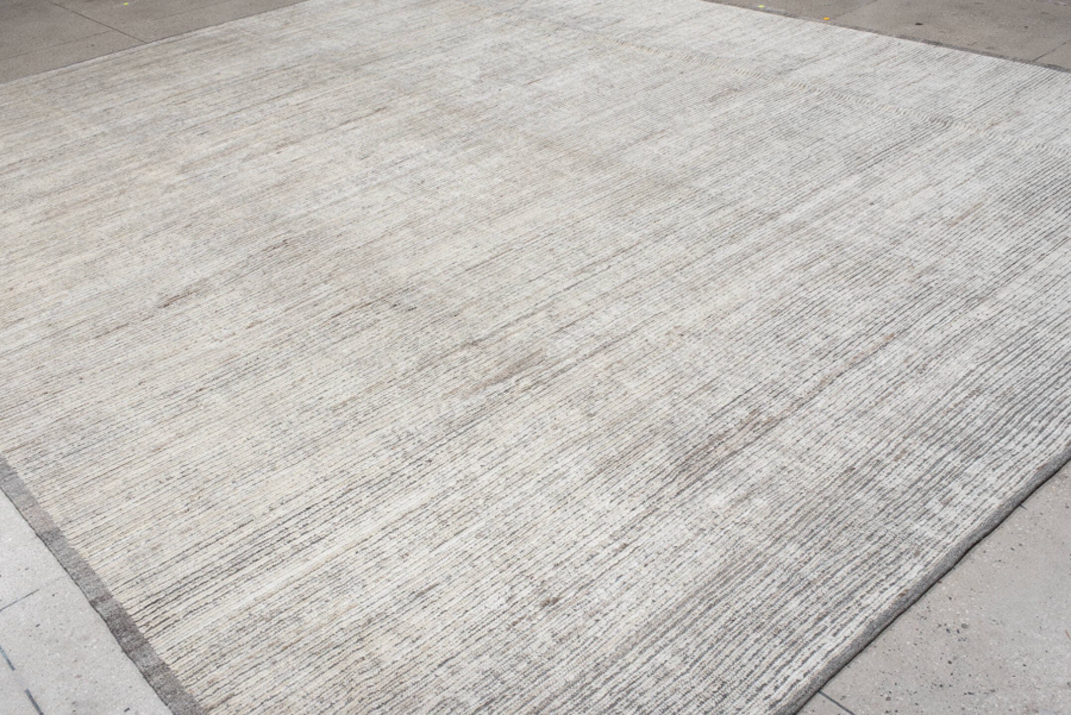 12' x 15' one-of-a-kind handmade vintage Tulu oversize rug. Color palette: ivory, gray, taupe, charcoal, cream, beige, black