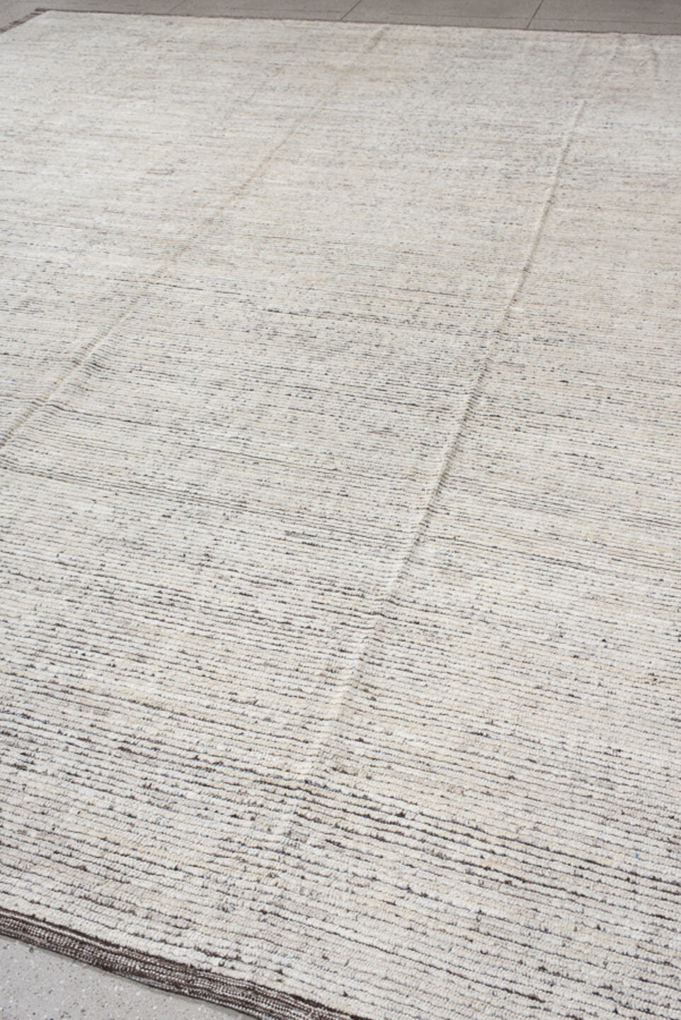 12' x 14' one-of-a-kind handmade vintage Tulu oversize rug. Color palette: ivory, charcoal, taupe, cream, gray, black, beige