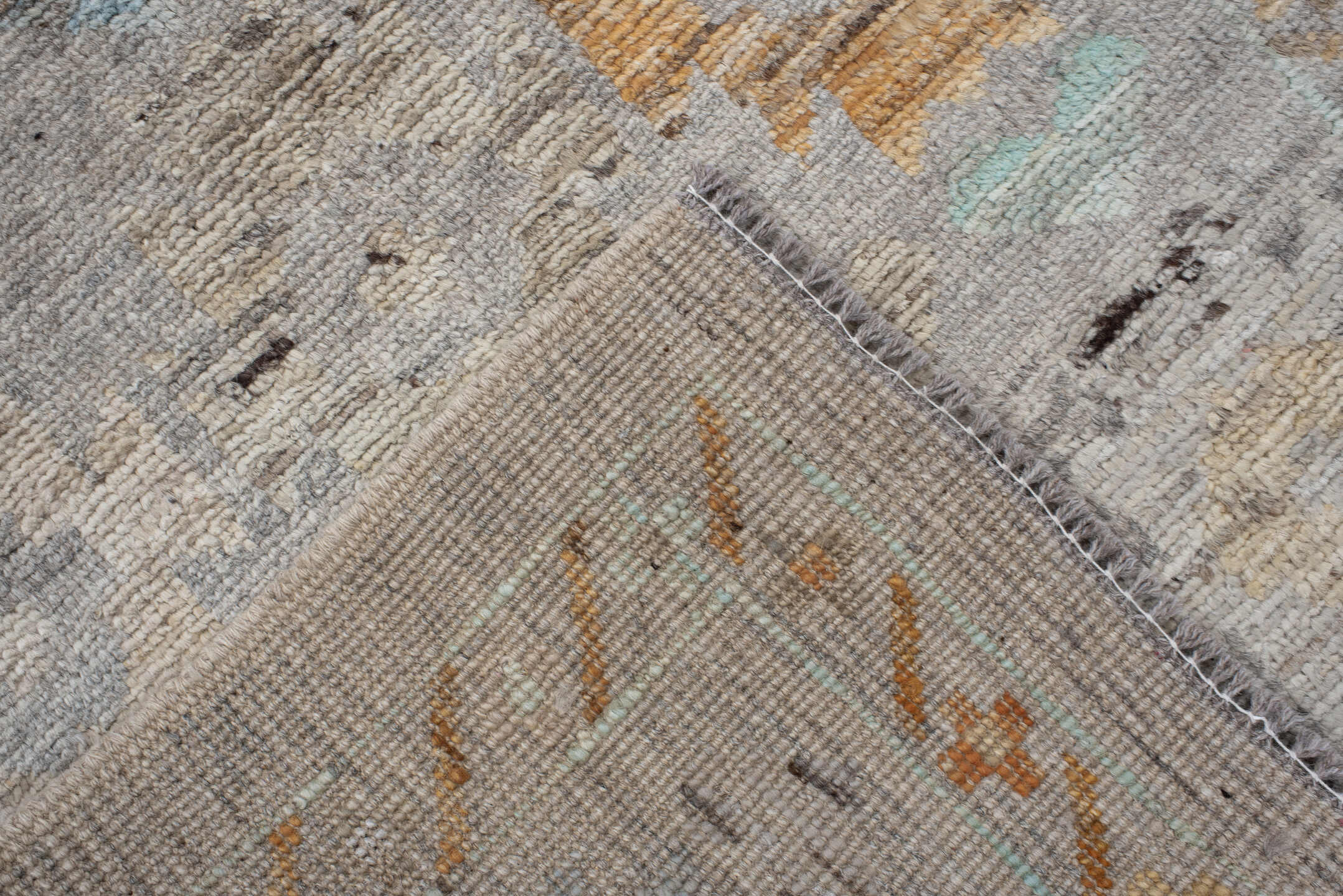 2' x 10' one-of-a-kind handmade vintage Tulu runner rug. Color palette: gray, ivory, aqua, apricot, taupe, charcoal, sand