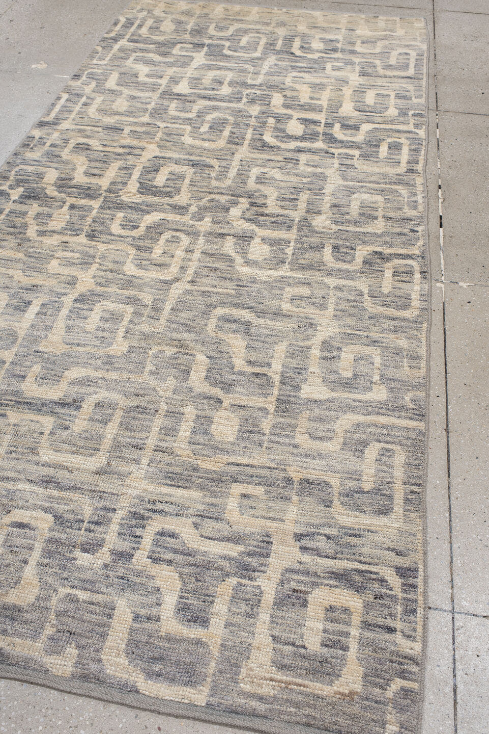 4' x 9' one-of-a-kind handmade vintage Tulu runner rug. Color palette: ivory, gray, slate, cream