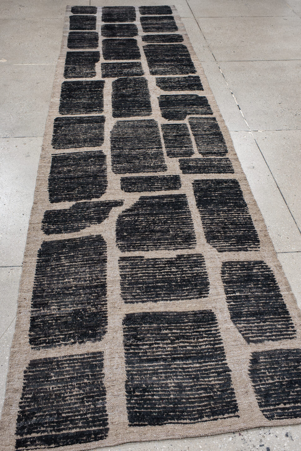 3' x 12' one-of-a-kind handmade vintage Tulu runner rug. Color palette: charcoal, taupe, ivory, gray, black, beige
