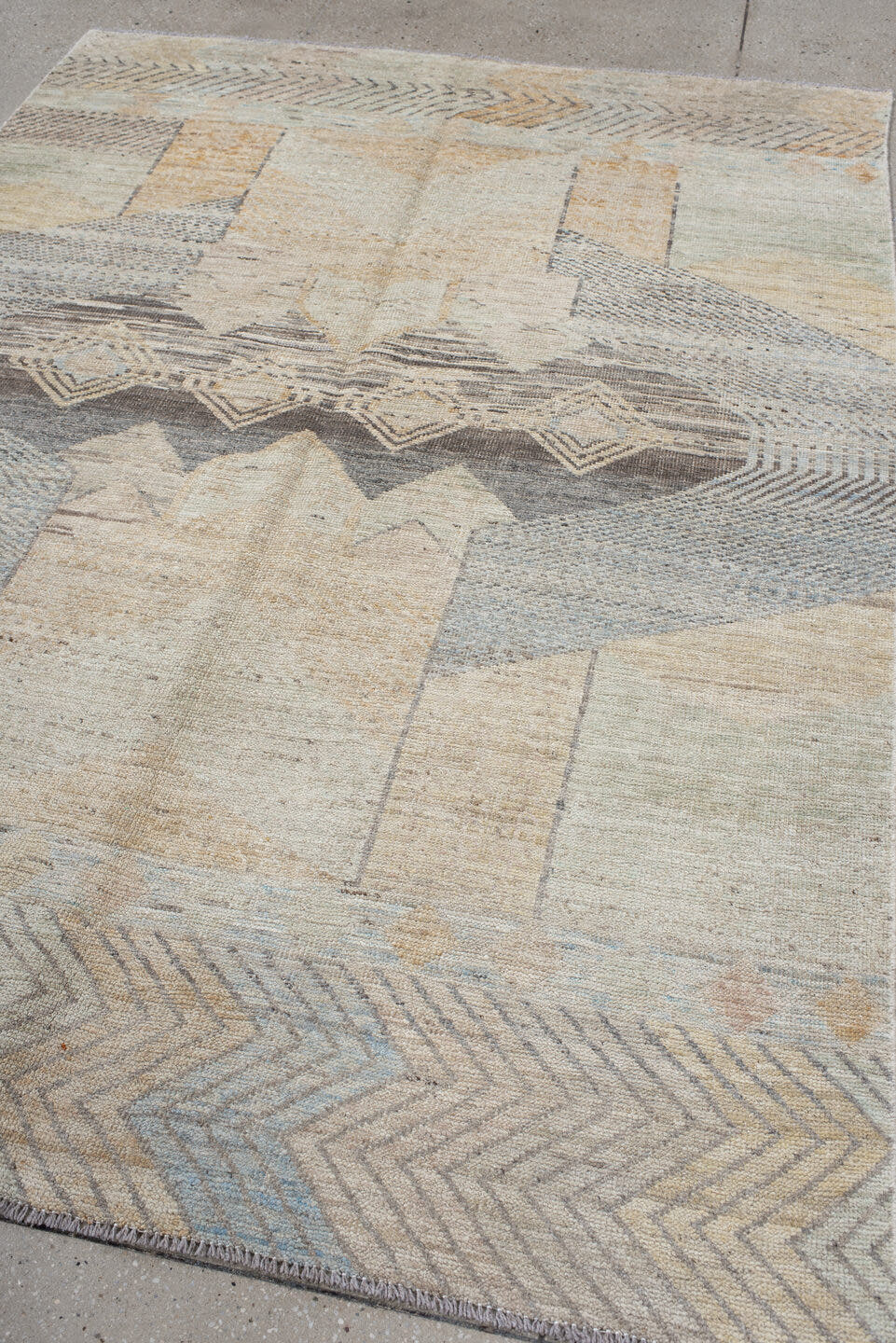 5' x 7' one-of-a-kind handmade vintage Tulu rug. Color palette: ivory, taupe, gray, pale blue, cream, charcoal, sand, beige