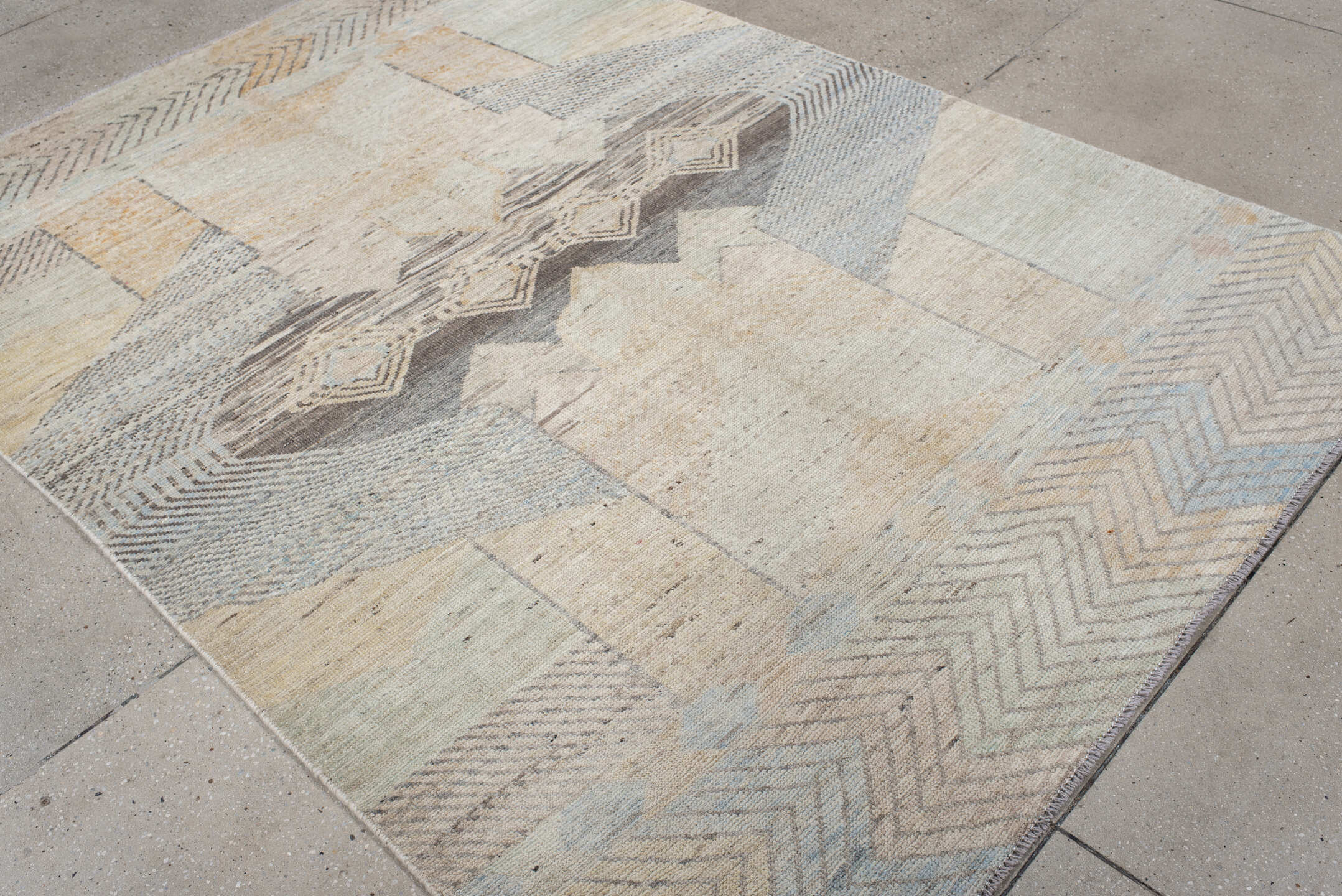 5' x 7' one-of-a-kind handmade vintage Tulu rug. Color palette: ivory, taupe, gray, pale blue, cream, charcoal, sand, beige