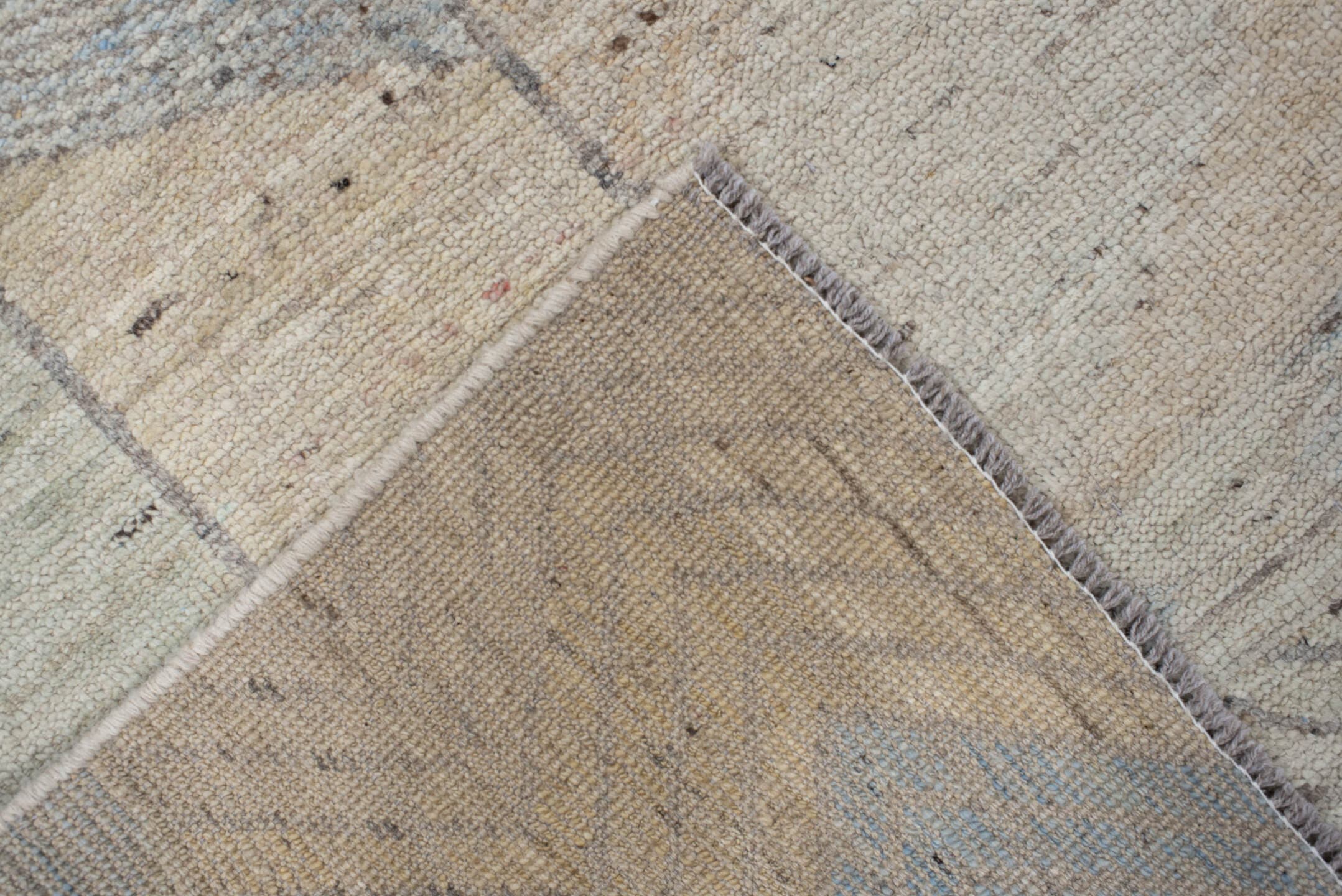 5' x 7' one-of-a-kind handmade vintage Tulu rug. Color palette: ivory, taupe, gray, pale blue, cream, charcoal, sand, beige