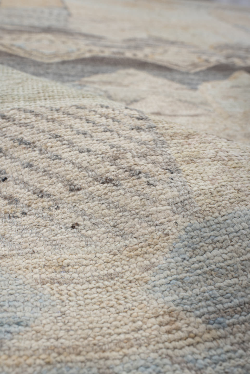 5' x 7' one-of-a-kind handmade vintage Tulu rug. Color palette: ivory, taupe, gray, pale blue, cream, charcoal, sand, beige