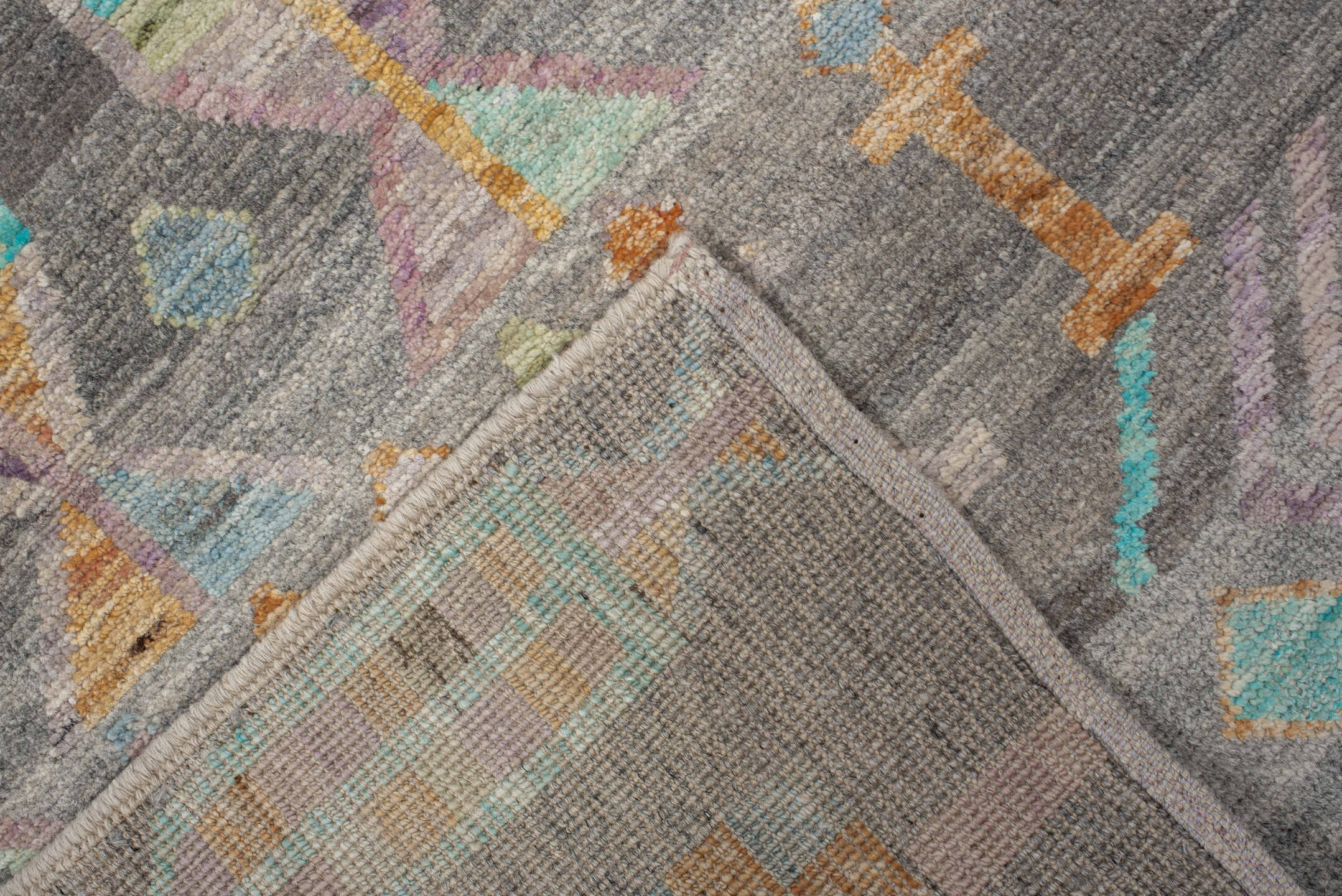 2' x 9' one-of-a-kind handmade vintage Tulu runner rug. Color palette: charcoal, aqua, ivory, lavender, peach, taupe, sage