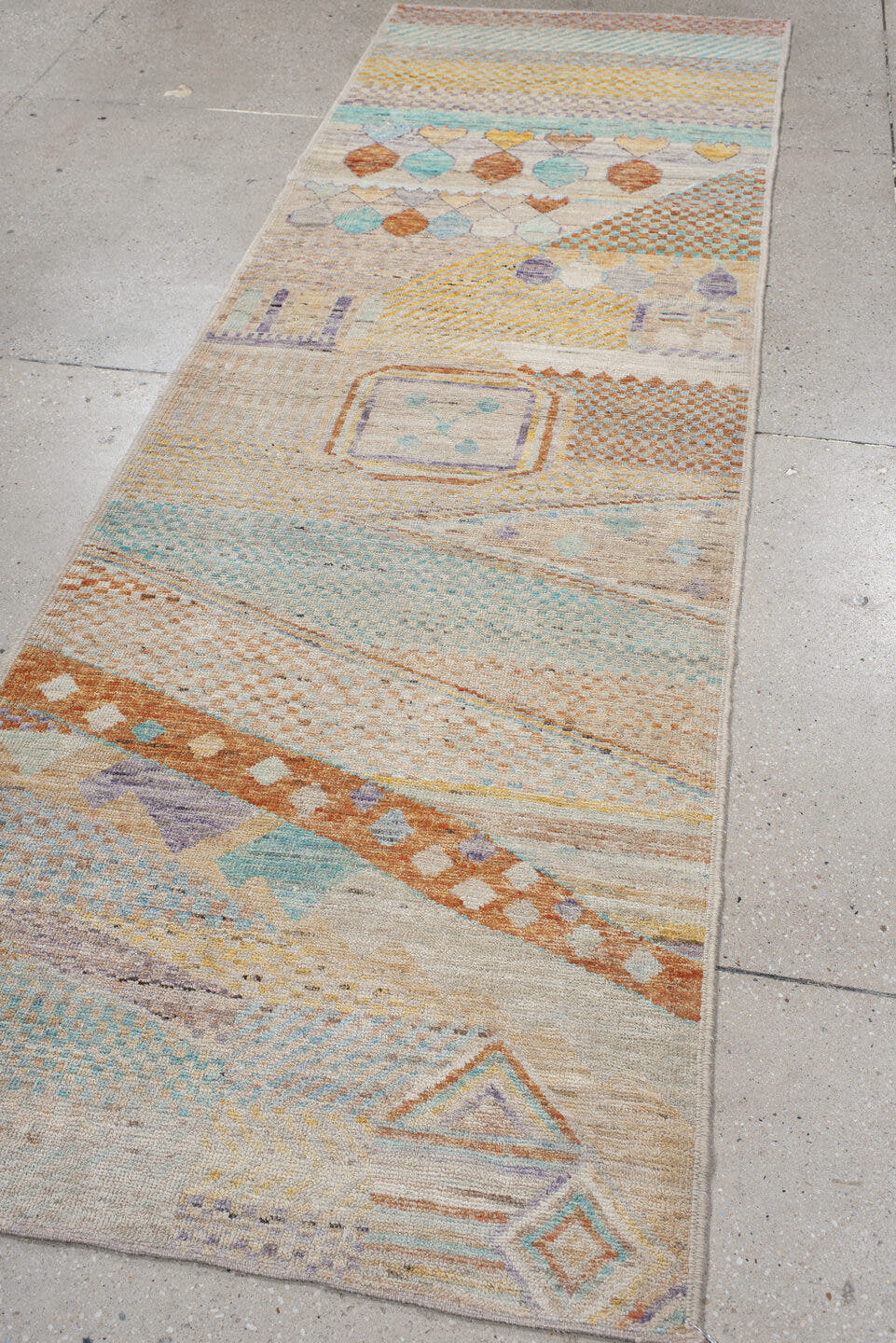 3' x 9' one-of-a-kind handmade vintage Tulu runner rug. Color palette: ivory, aqua, terra cotta, gold, lavender, taupe, teal