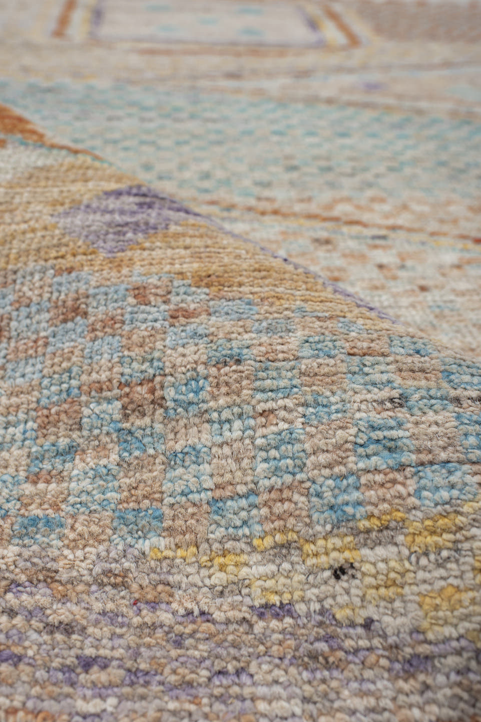 3' x 9' one-of-a-kind handmade vintage Tulu runner rug. Color palette: ivory, aqua, terra cotta, gold, lavender, taupe, teal