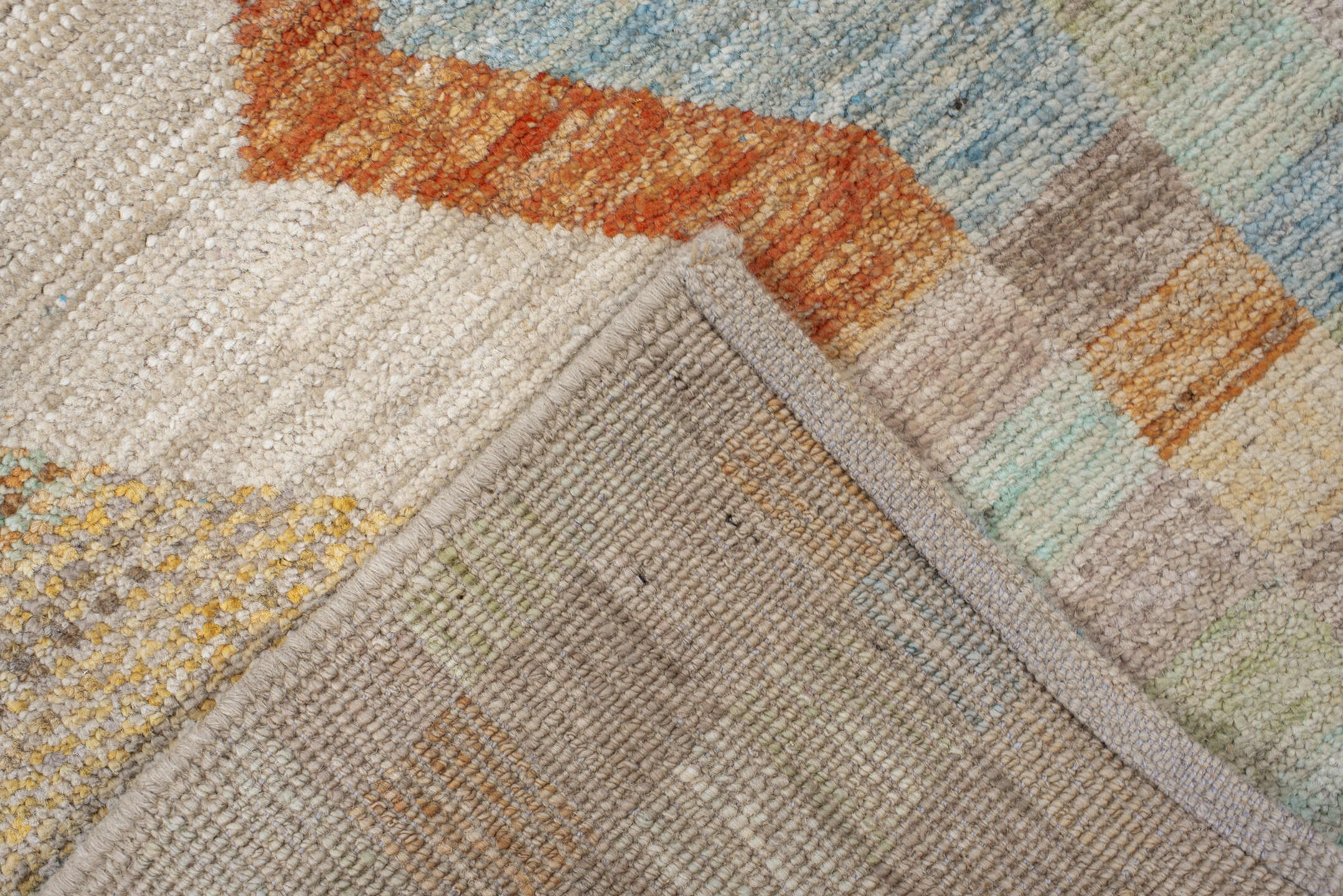 2' x 9' one-of-a-kind handmade vintage Tulu runner rug. Color palette: taupe, ivory, sage, terra cotta, pale blue, gold