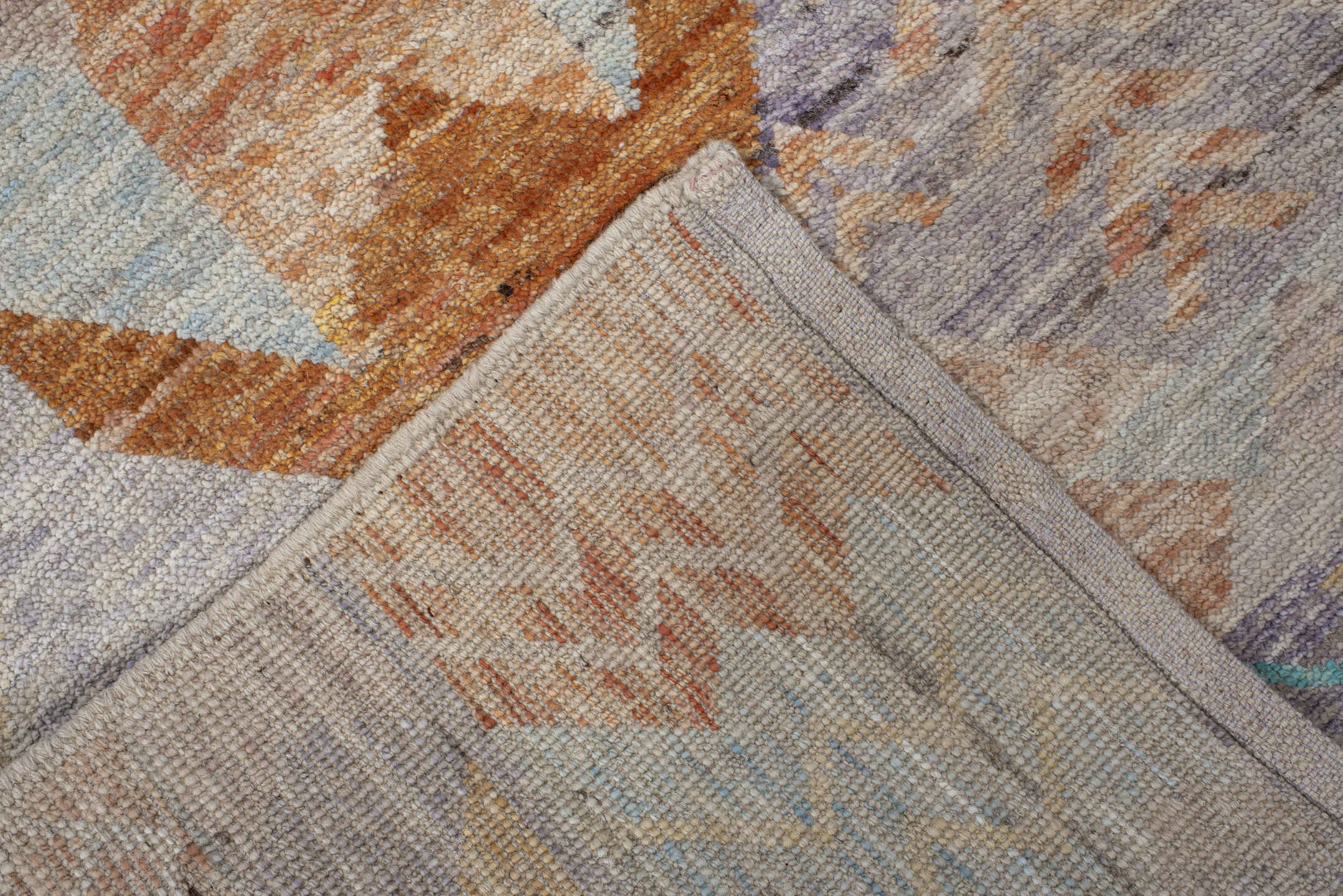 3' x 9' one-of-a-kind handmade vintage Tulu runner rug. Color palette: ivory, sky_blue, lavender, gold, rust, taupe, peach