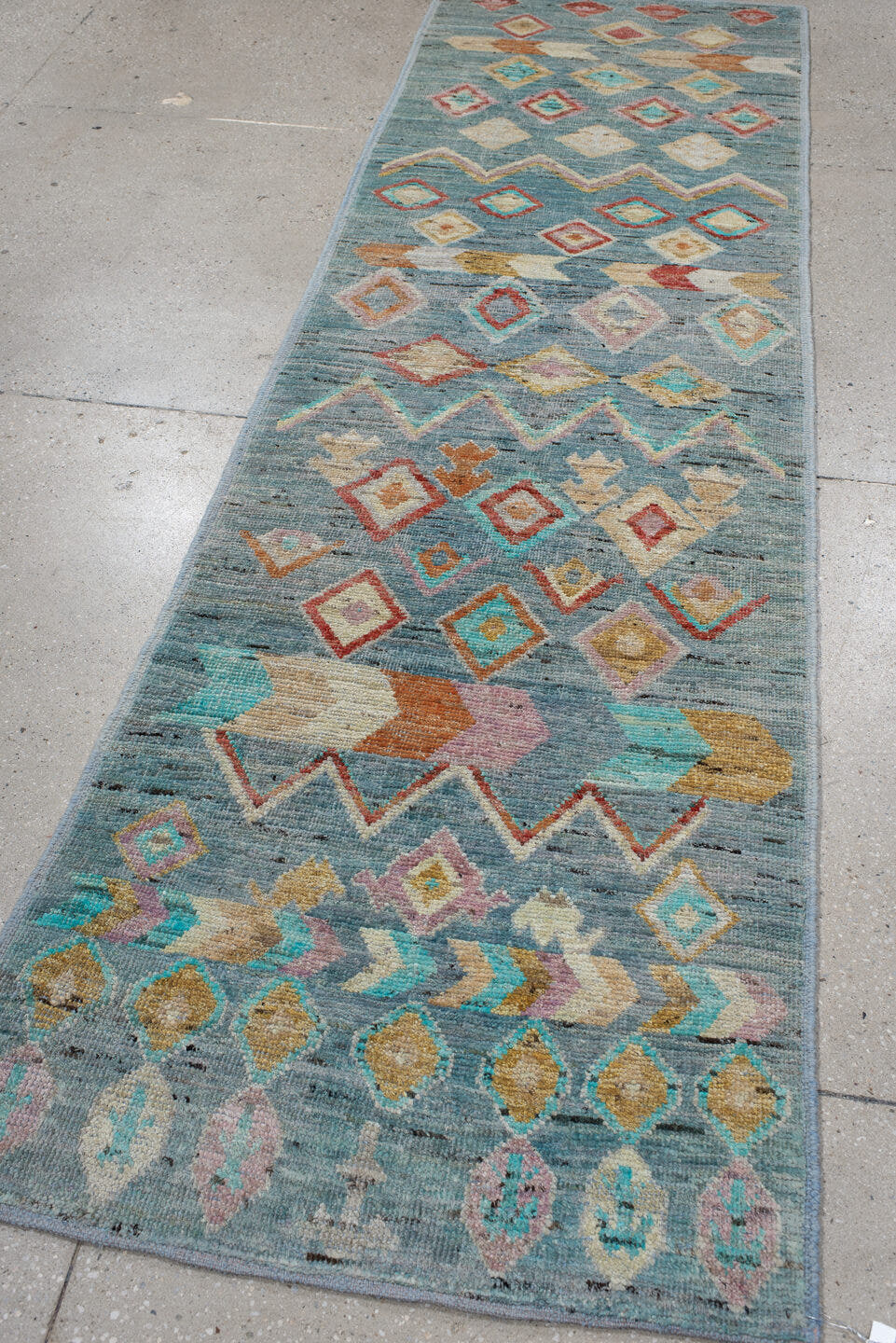 2' x 9' one-of-a-kind handmade vintage Tulu runner rug. Color palette: sky blue, ivory, turquoise, coral, gold, peach
