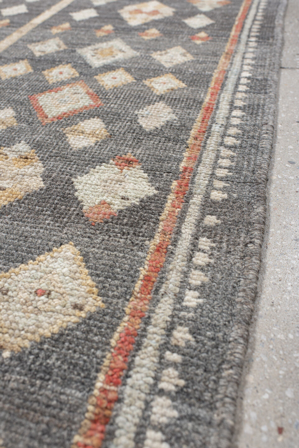 2' x 9' one-of-a-kind handmade vintage Tulu runner rug. Color palette: charcoal, ivory, camel, rust, cream, taupe, gray