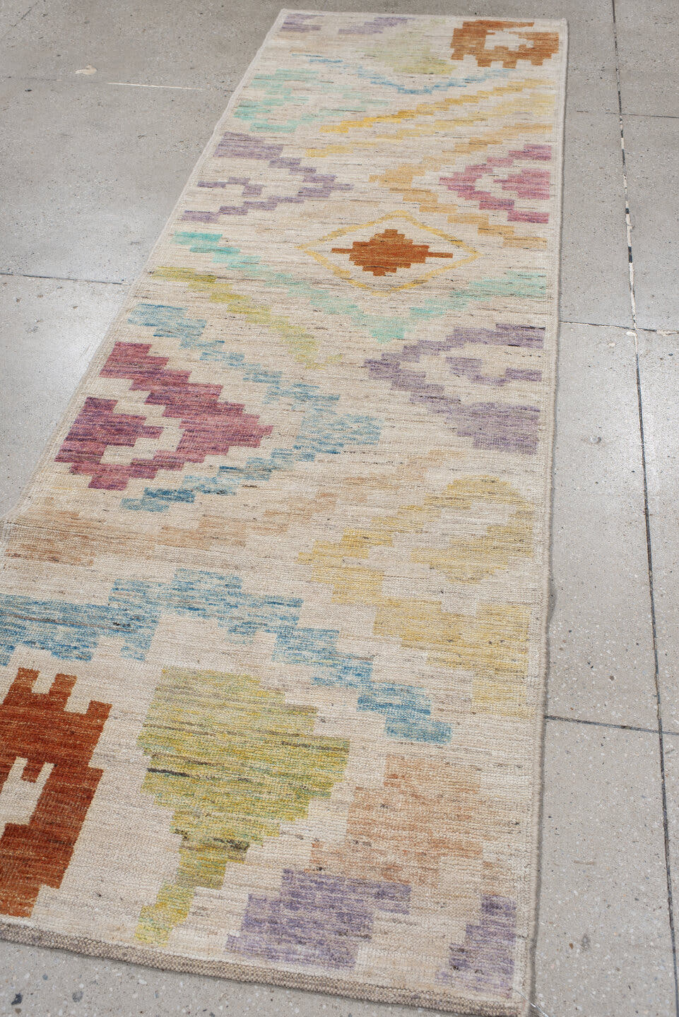 3' x 9' one-of-a-kind handmade vintage Tulu runner rug. Color palette: ivory, lavender, aqua, rust, gold, sage, rose, peach