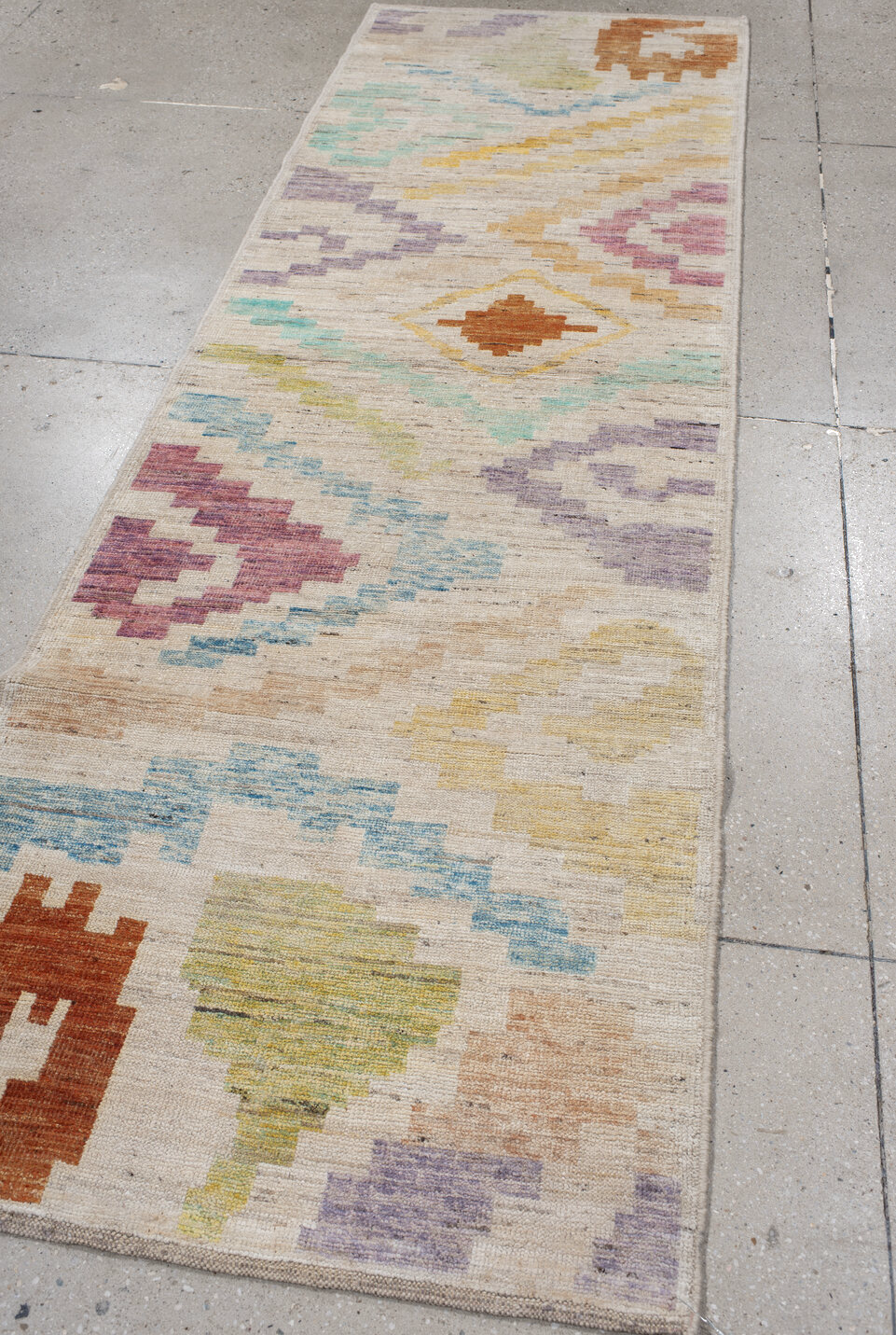 3' x 9' one-of-a-kind handmade vintage Tulu runner rug. Color palette: blue, brown, gray, light gray, off-white, pink