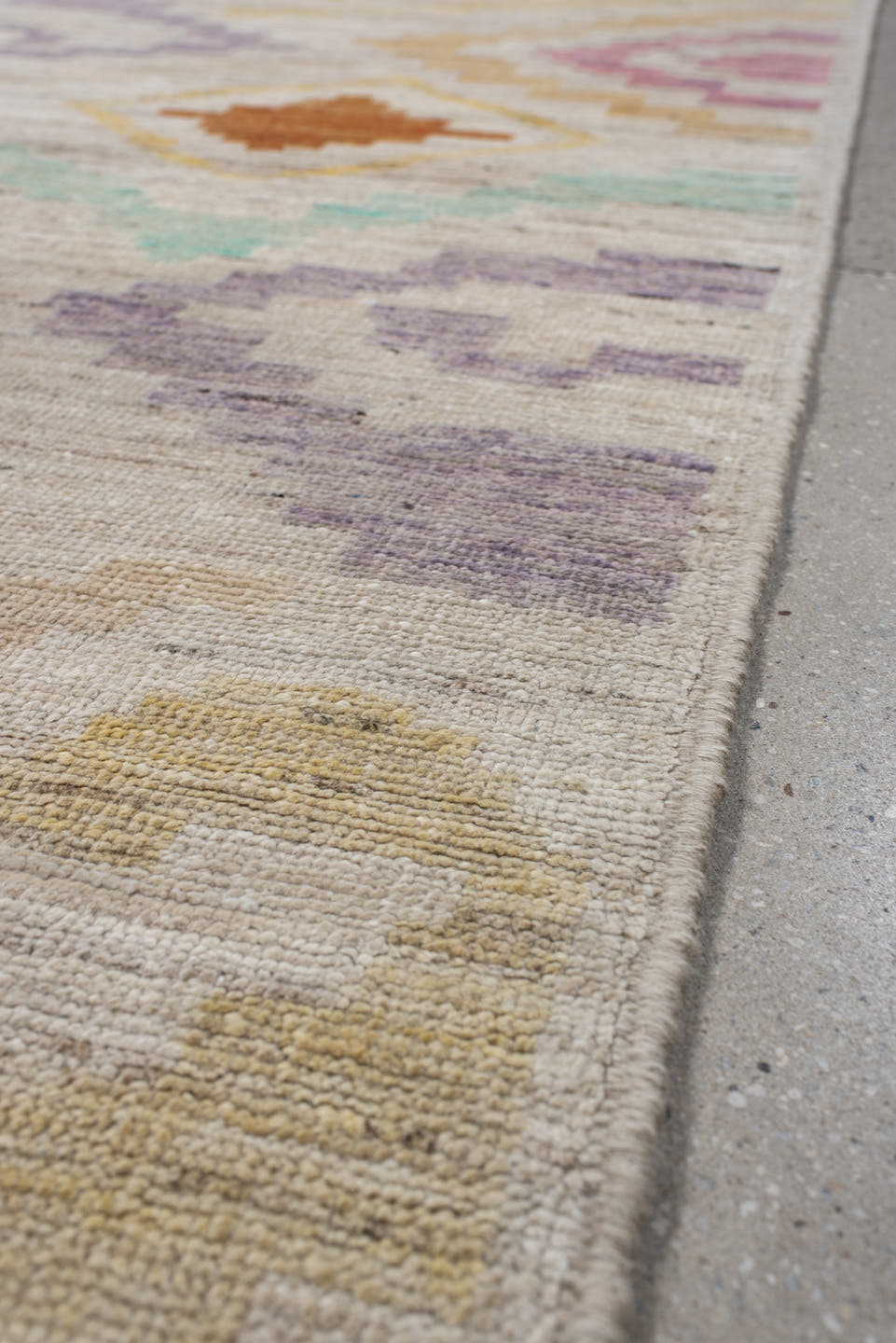3' x 9' one-of-a-kind handmade vintage Tulu runner rug. Color palette: ivory, lavender, aqua, rust, gold, sage, rose, peach