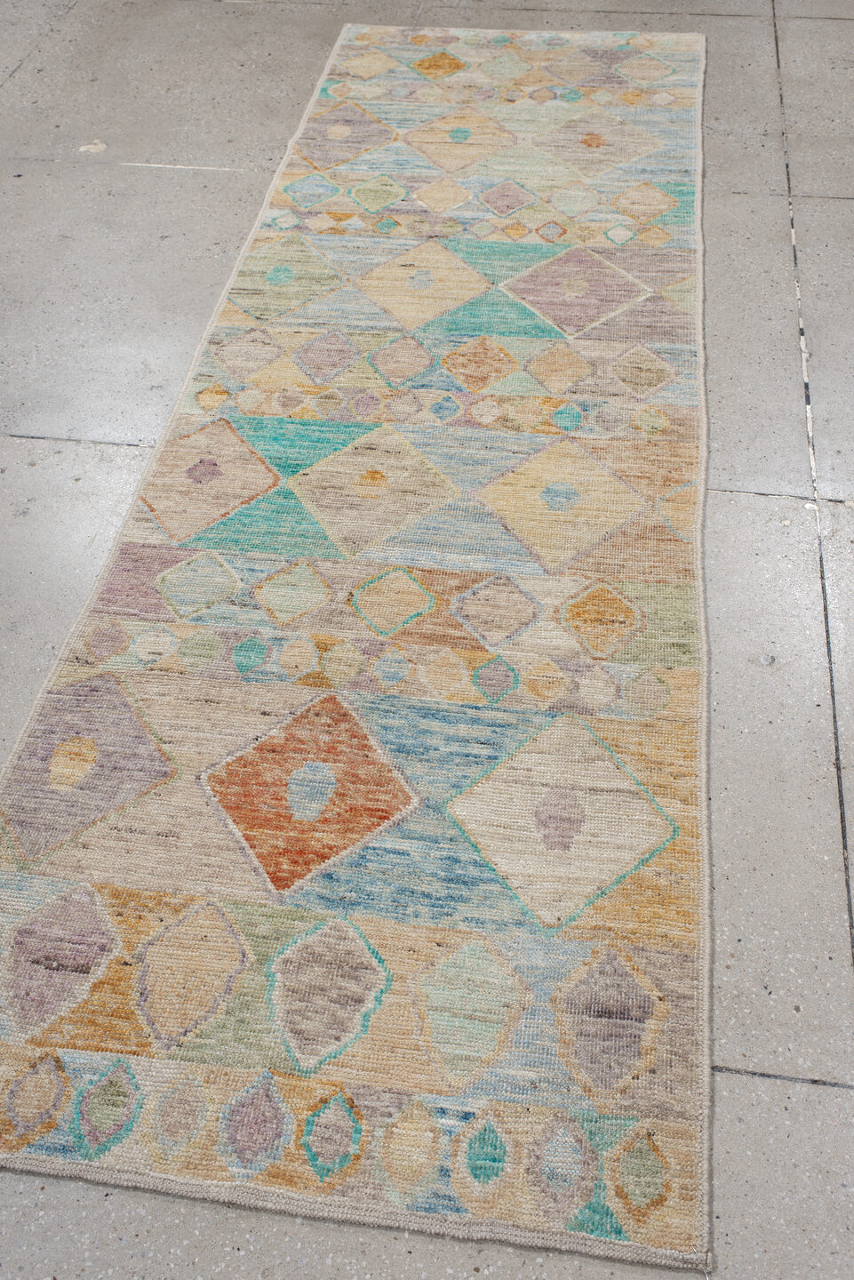 3' x 9' one-of-a-kind handmade vintage Tulu runner rug. Color palette: blue, brown, gray, green, light gray, off-white