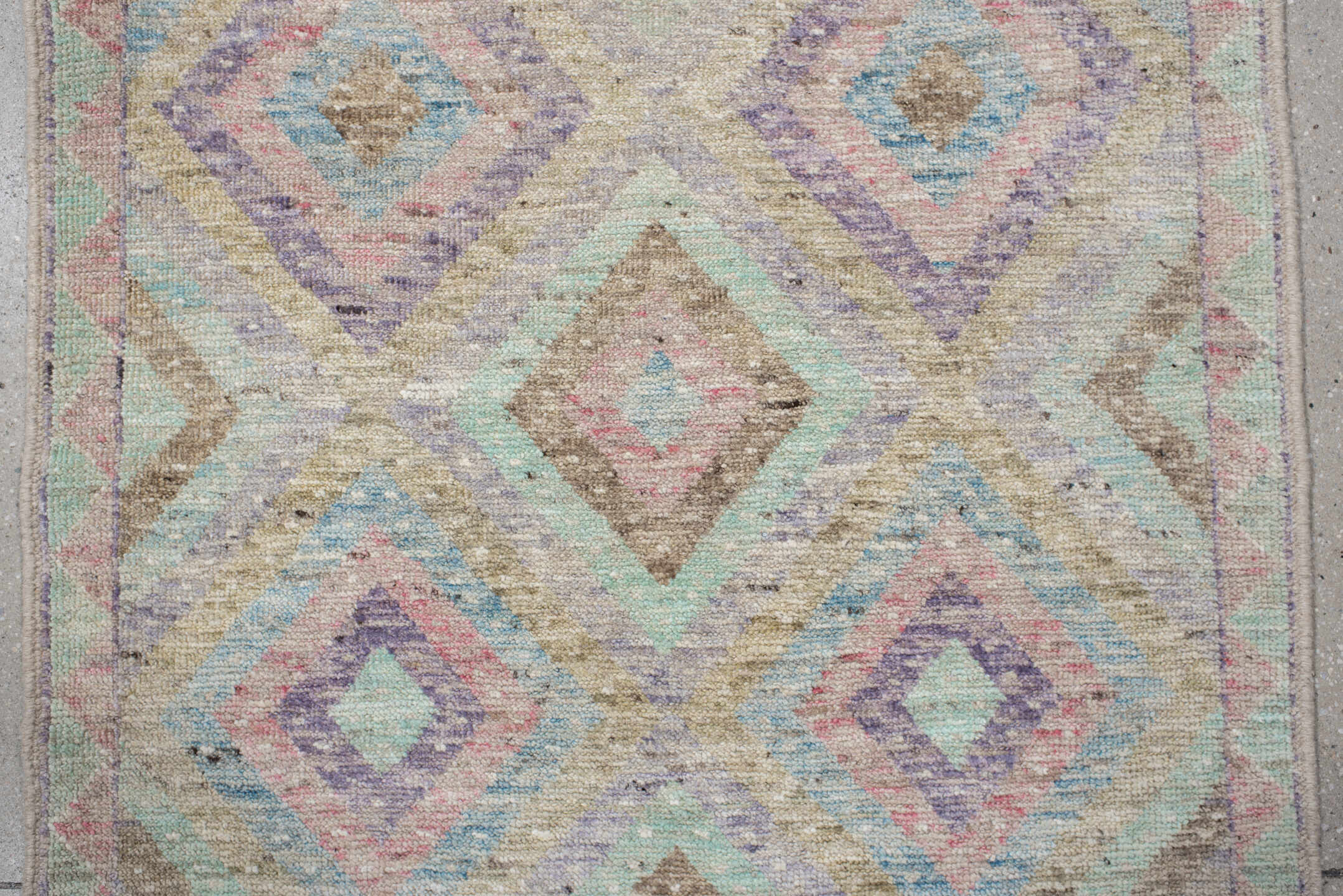 3' x 9' one-of-a-kind handmade vintage Tulu runner rug. Color palette: ivory, aqua, tan, blush, lavender, sage, gold, teal