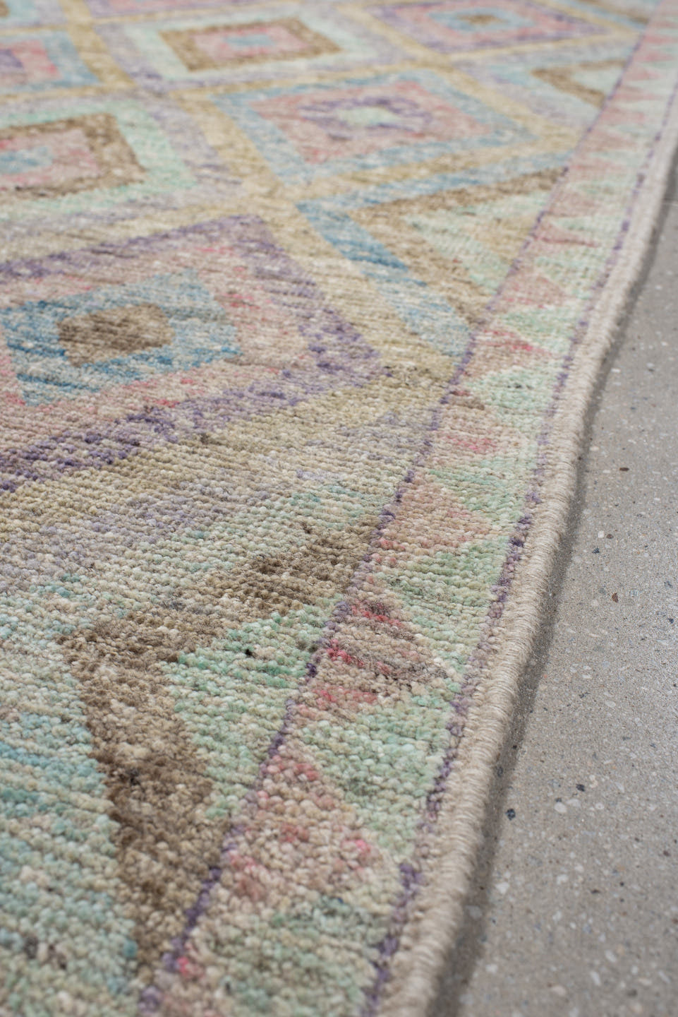 3' x 9' one-of-a-kind handmade vintage Tulu runner rug. Color palette: ivory, aqua, tan, blush, lavender, sage, gold, teal