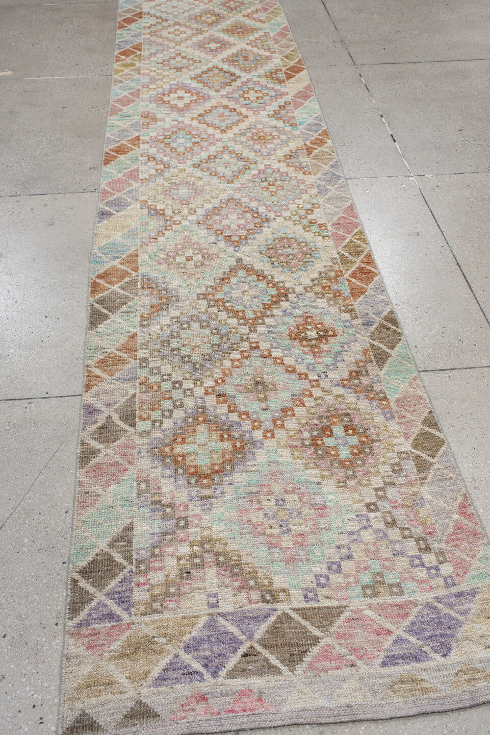 2' x 12' one-of-a-kind handmade vintage Tulu runner rug. Color palette: ivory, taupe, aqua, rust, lavender, rose, sage, sand