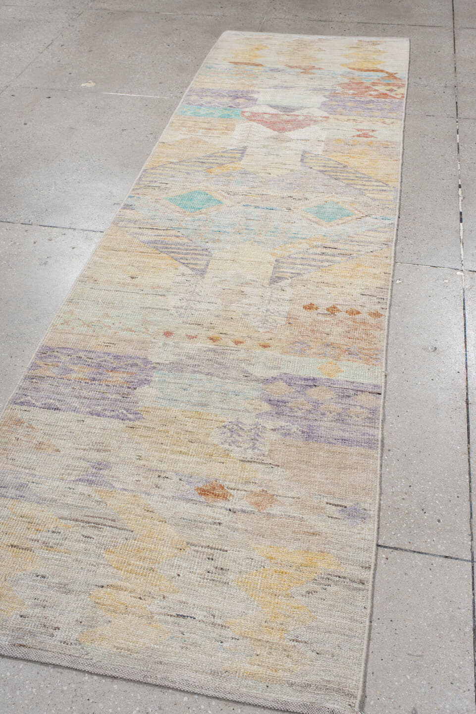 2' x 10' one-of-a-kind handmade vintage Tulu runner rug. Color palette: ivory, lavender, aqua, pale yellow, coral, beige