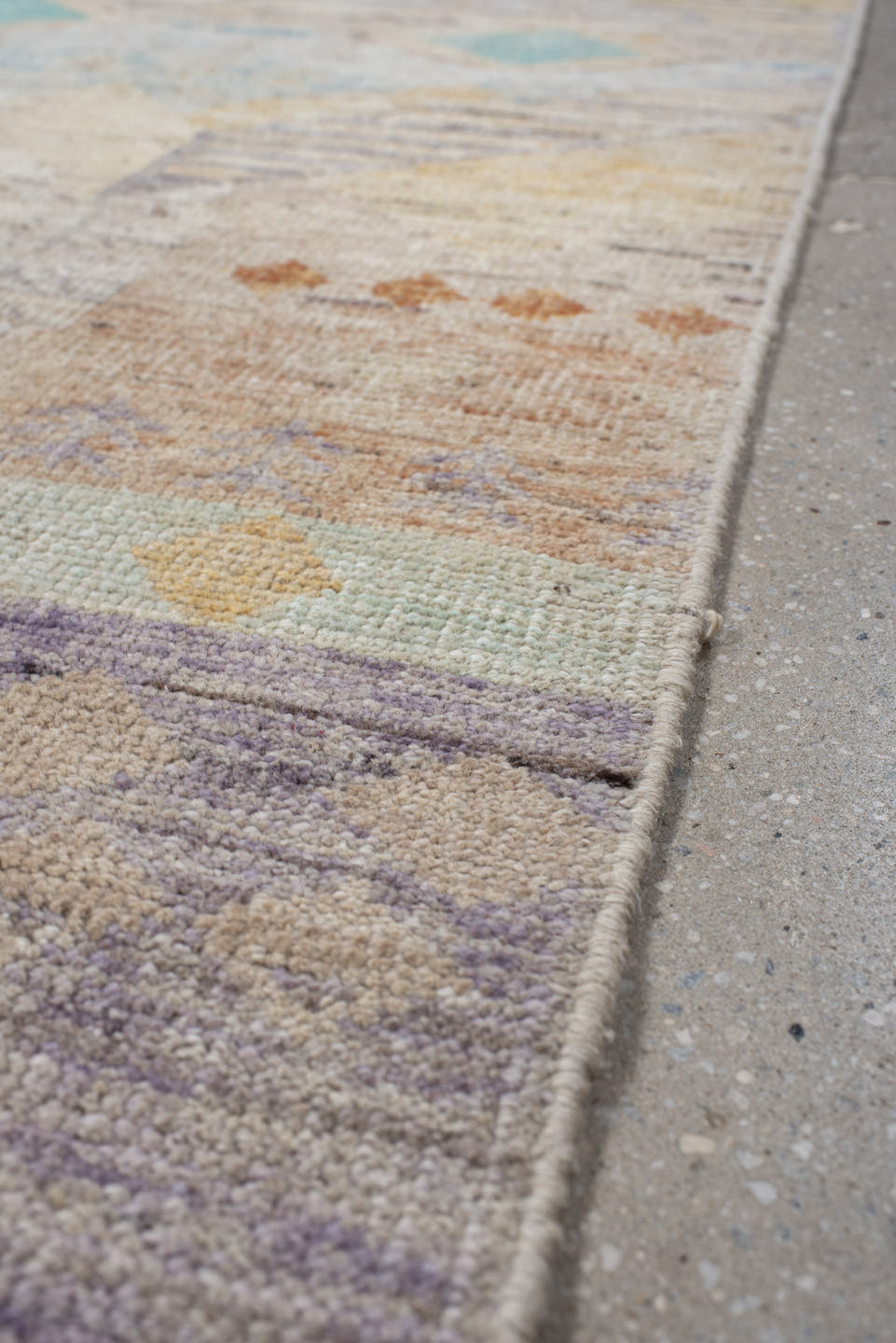 2' x 10' one-of-a-kind handmade vintage Tulu runner rug. Color palette: ivory, lavender, aqua, pale yellow, coral, beige