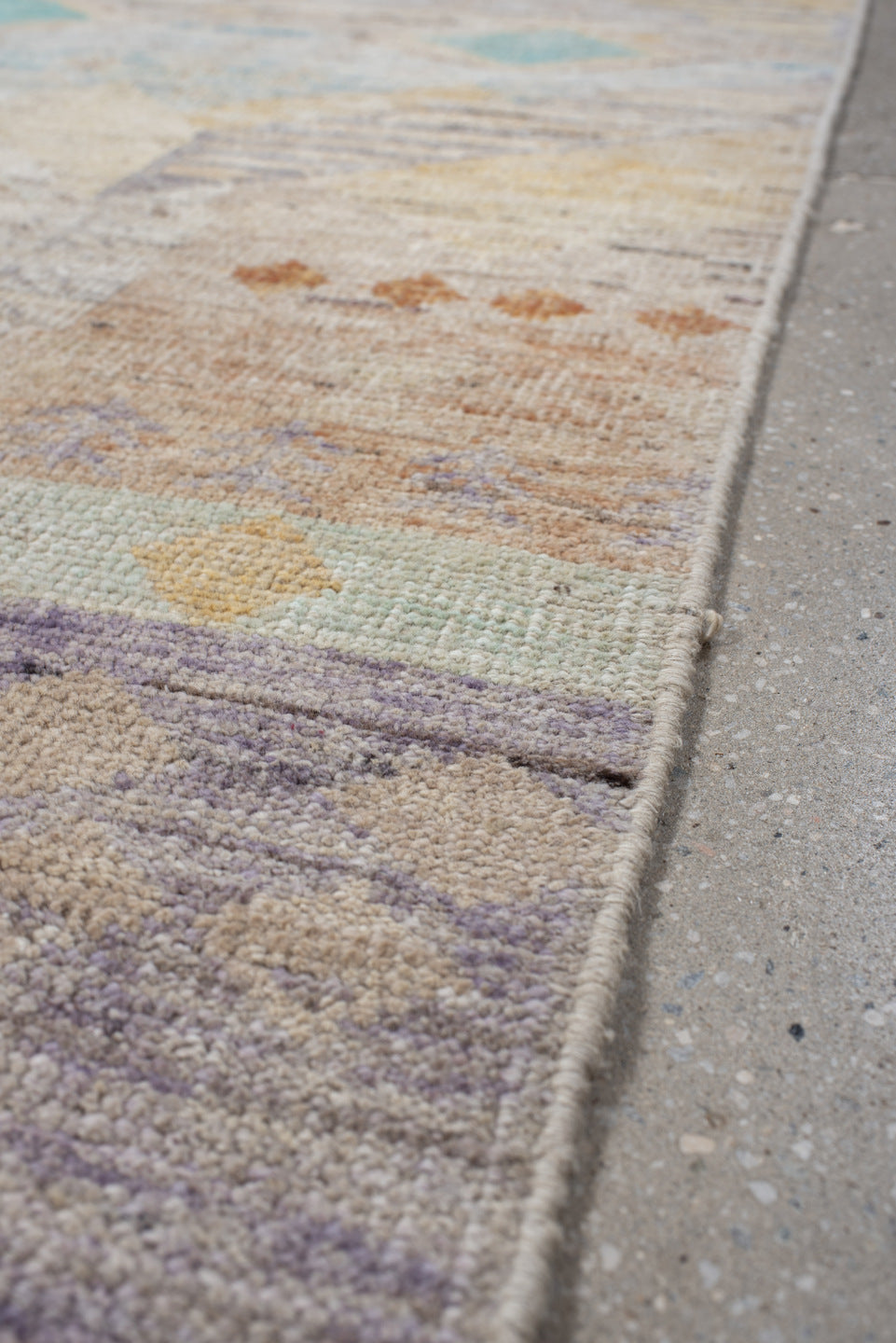 2' x 10' one-of-a-kind handmade vintage Tulu runner rug. Color palette: ivory, lavender, aqua, pale yellow, coral, beige