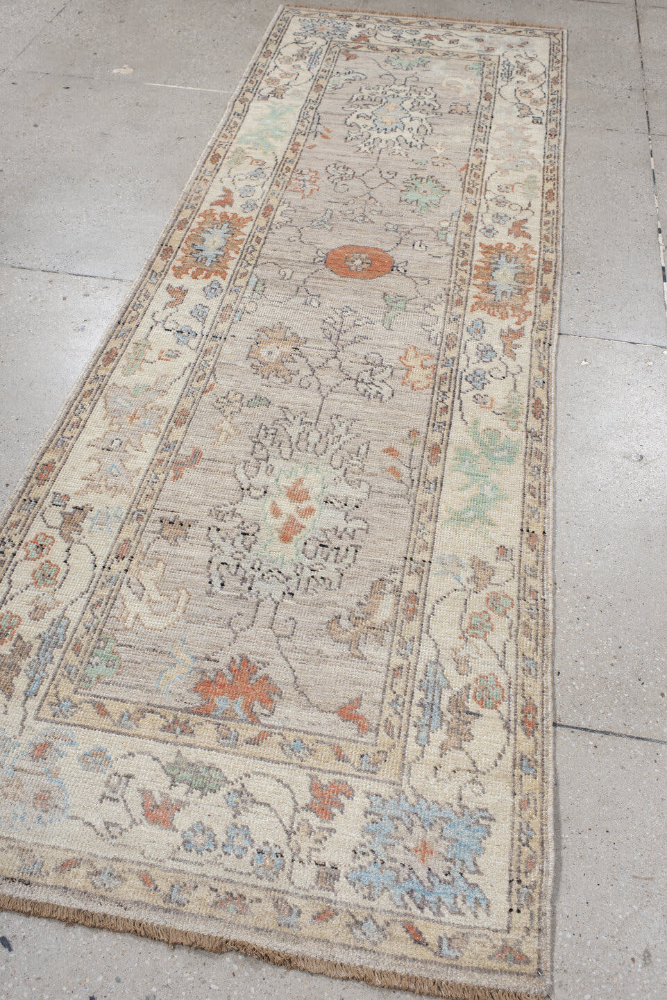 3' x 9' one-of-a-kind handmade vintage Oushak runner rug. Color palette: ivory, taupe, pale_blue, sage, coral, charcoal