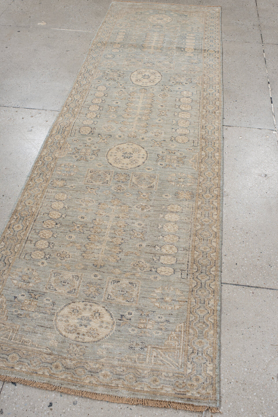 2' x 9' one-of-a-kind handmade vintage Khotan runner rug. Color palette: pale blue, ivory, taupe, beige, camel, slate