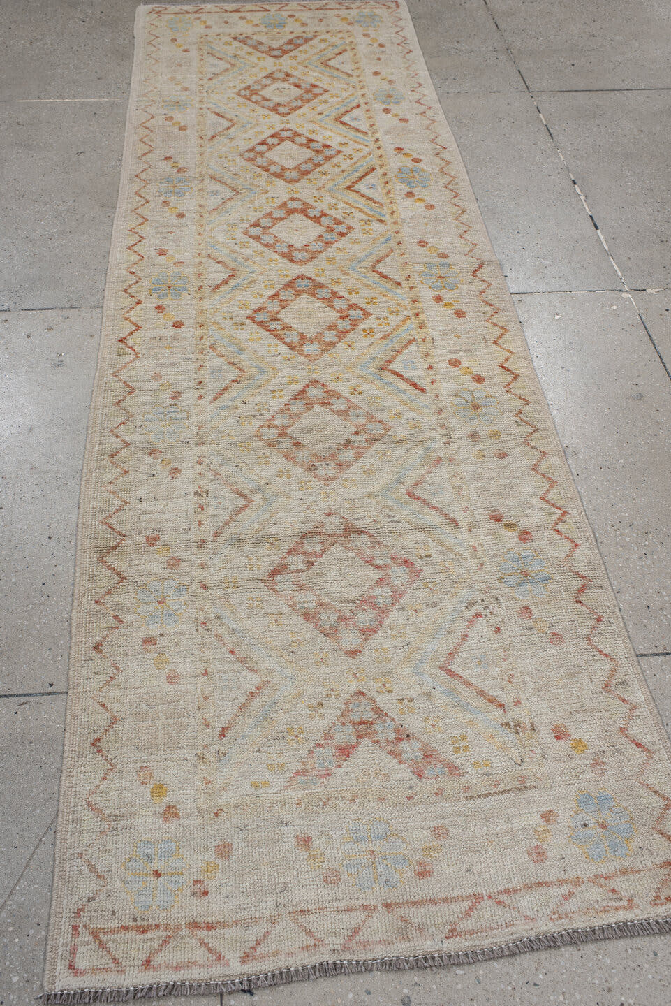 2' x 9' one-of-a-kind handmade vintage Kilim runner rug. Color palette: ivory, coral, pale blue, soft gold, beige