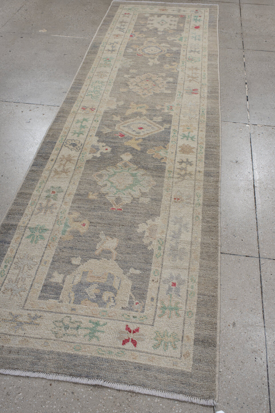3' x 10' one-of-a-kind handmade vintage Oushak runner rug. Color palette: gray, ivory, cream, sage, taupe, rose, beige
