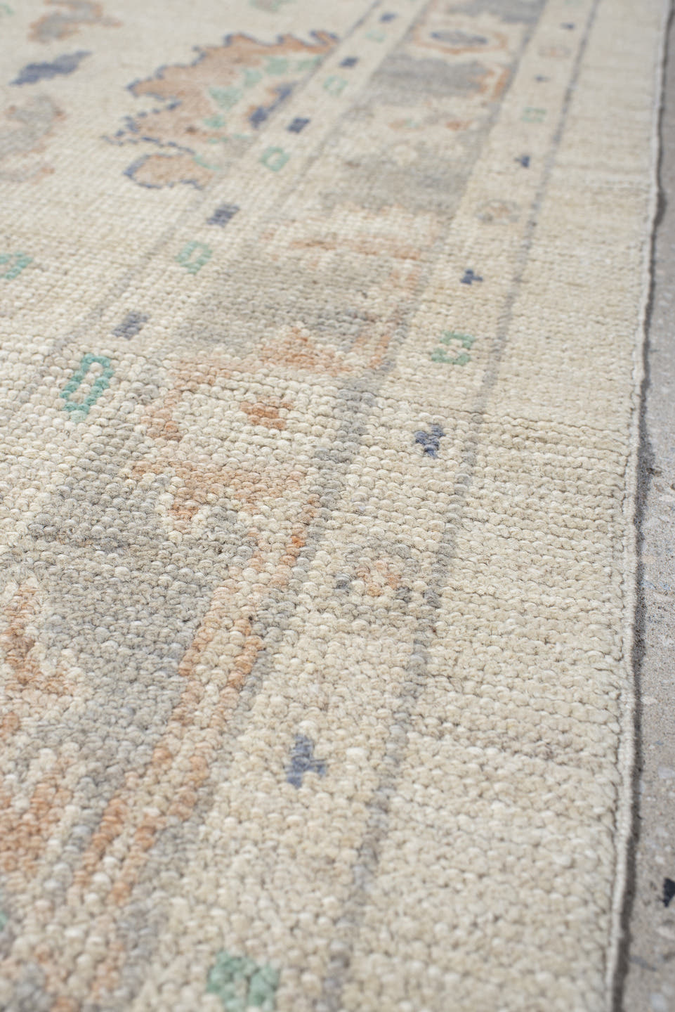 2' x 10' one-of-a-kind handmade vintage Oushak runner rug. Color palette: ivory, light gray, aqua, blue, beige, peach, teal