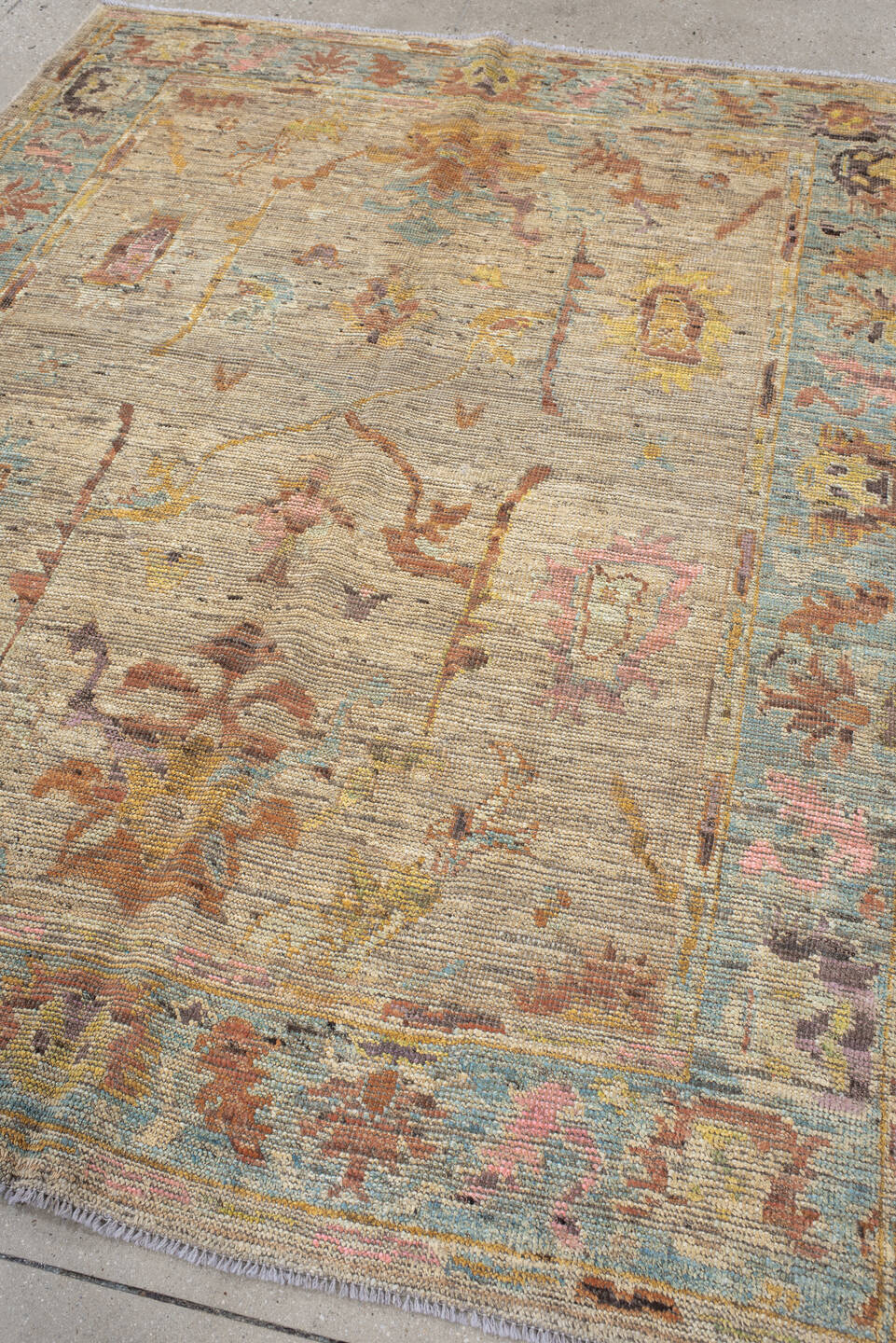 5' x 7' one-of-a-kind handmade vintage Oushak rug. Color palette: beige, aqua, terra cotta, ivory, sage, gold, rose