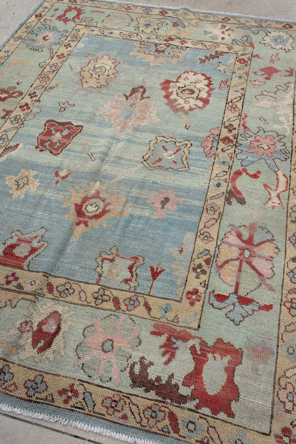 5' x 7' one-of-a-kind handmade vintage Oushak medium size rug. Color palette: sky blue, ivory, pale aqua, rust, blush, taupe