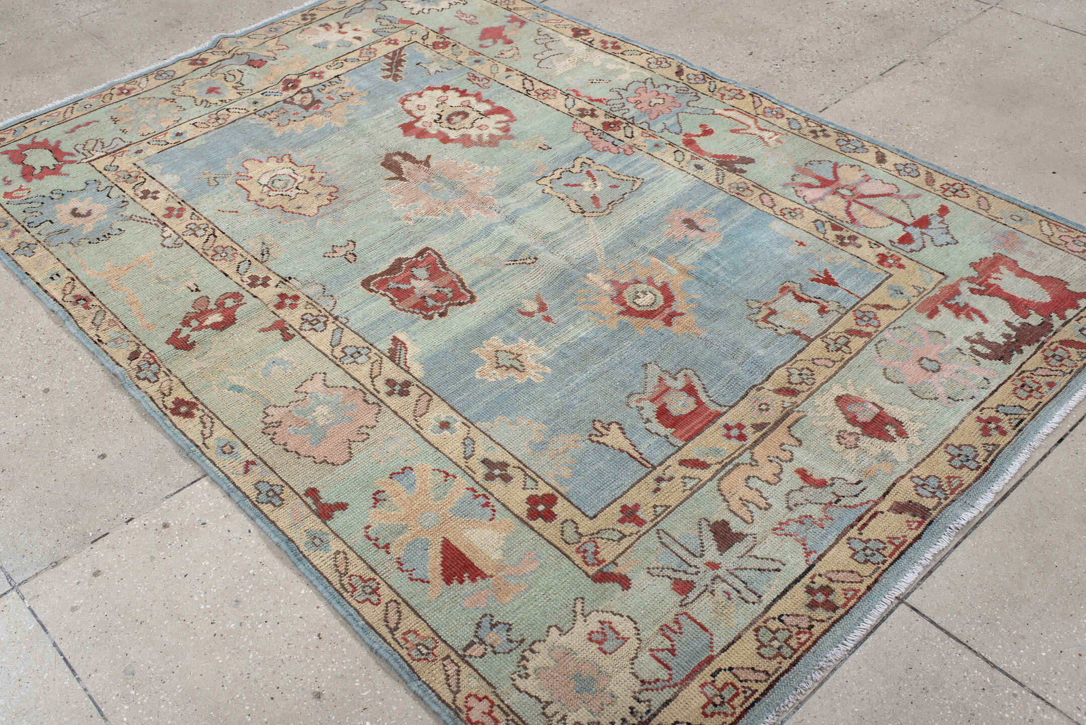 5' x 7' one-of-a-kind handmade vintage Oushak medium size rug. Color palette: sky blue, ivory, pale aqua, rust, blush, taupe